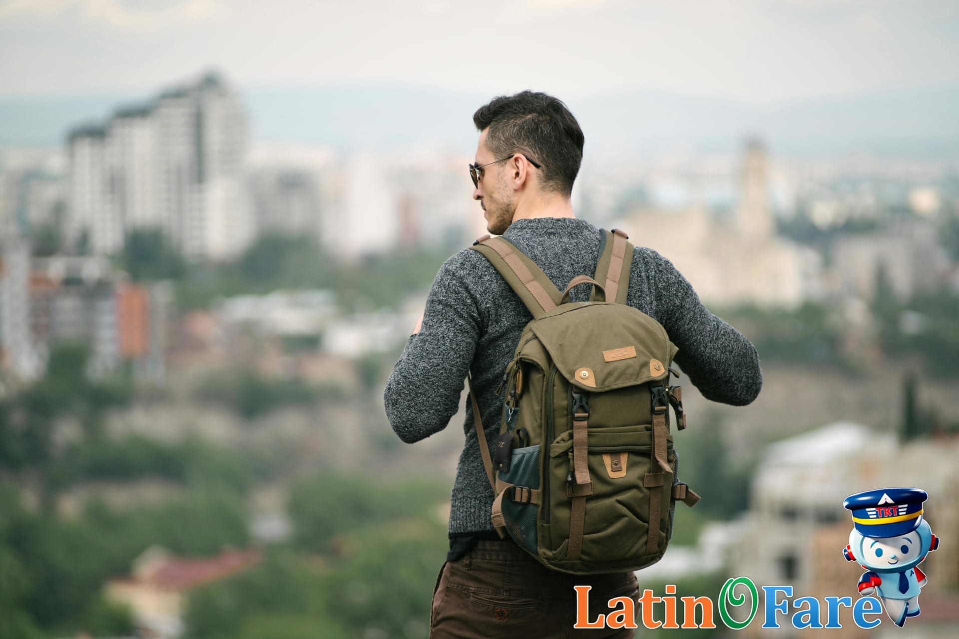 Budget traveler enjoying skyline view in new city after using multi-city booking strategy