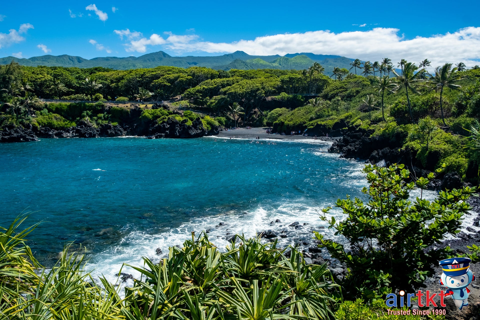 Hikers on Maui trail with ocean view on Road to Hana