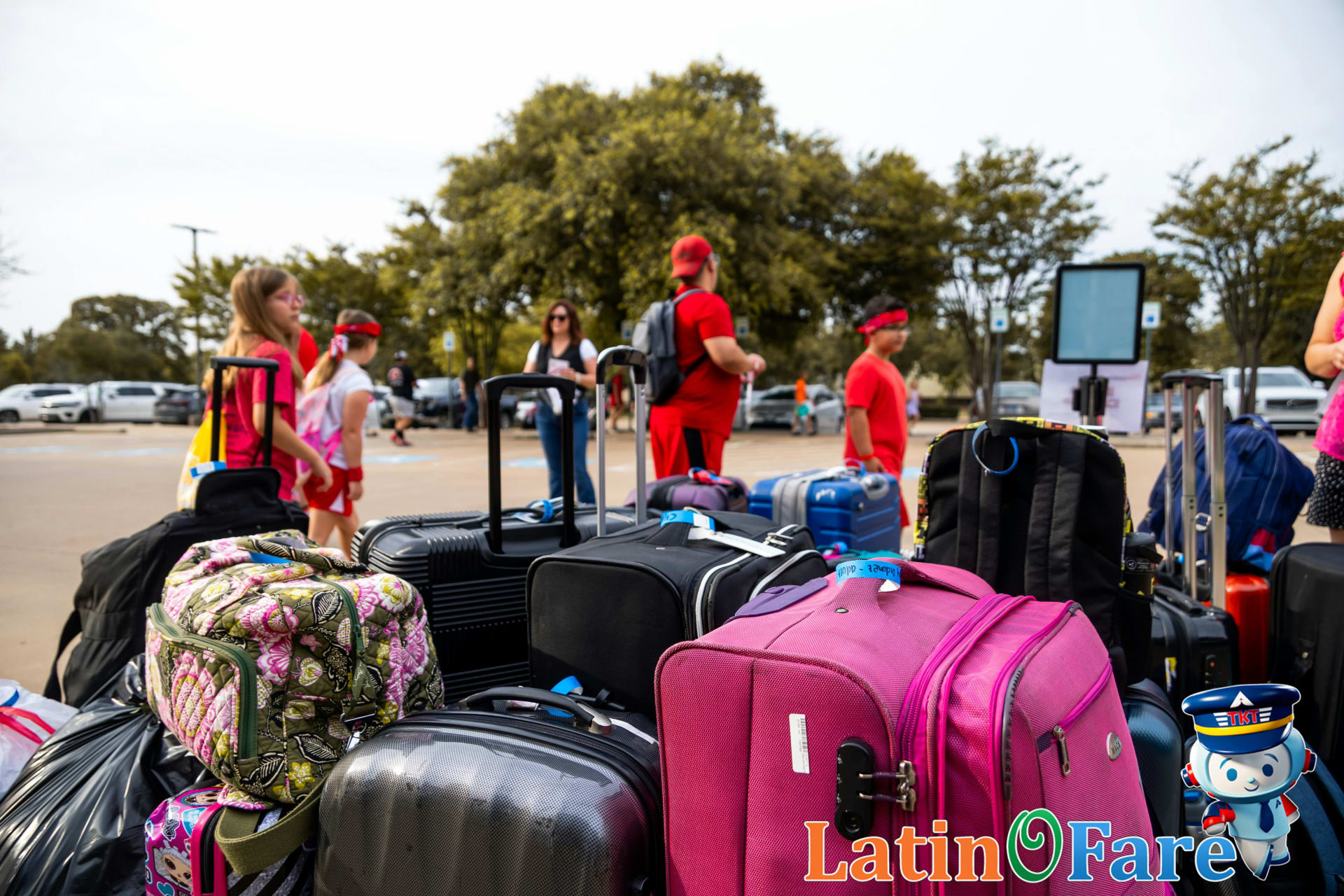 Family loading suitcases into Hertz rental car, maximizing Gold Plus Rewards value for travelers