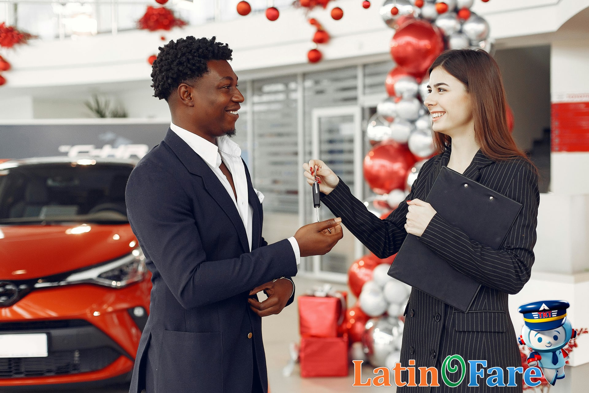 Hertz agent handing car keys to smiling customer in rental office, representing Hertz car rental experience.