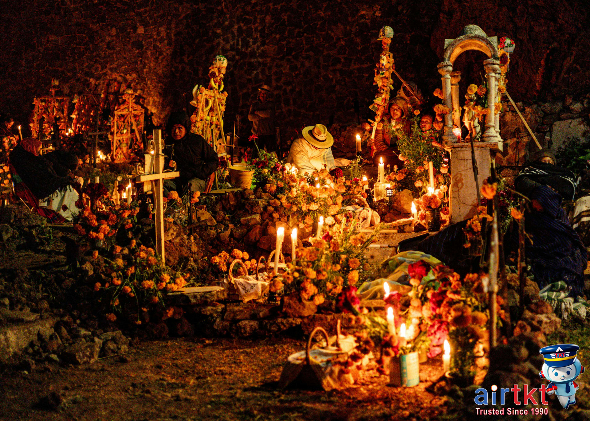 Nighttime altar lighting during Day of the Dead in Mexico with candles and marigolds