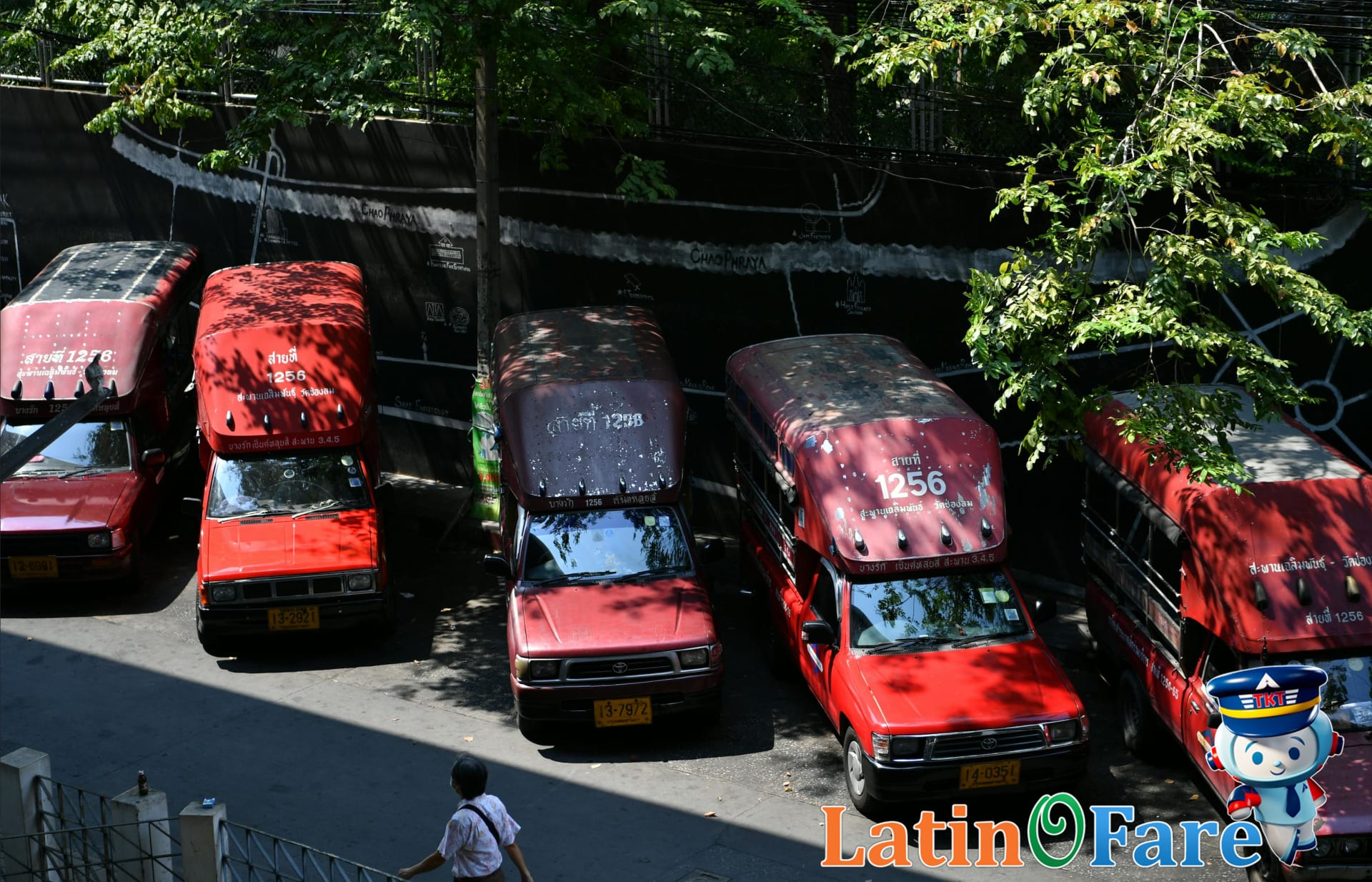 Busy Chiang Mai street with colorful Songthaew taxis for first-time visitors exploring Northern Thailand.