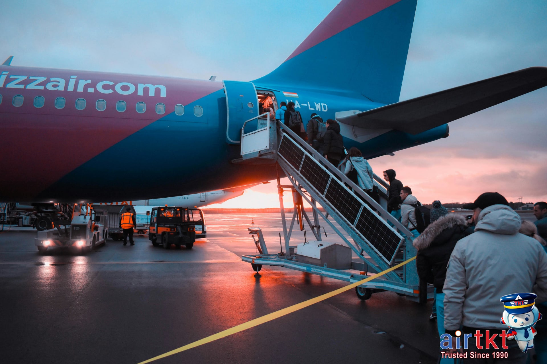 Easter travelers boarding a plane at sunset for holiday travel experience