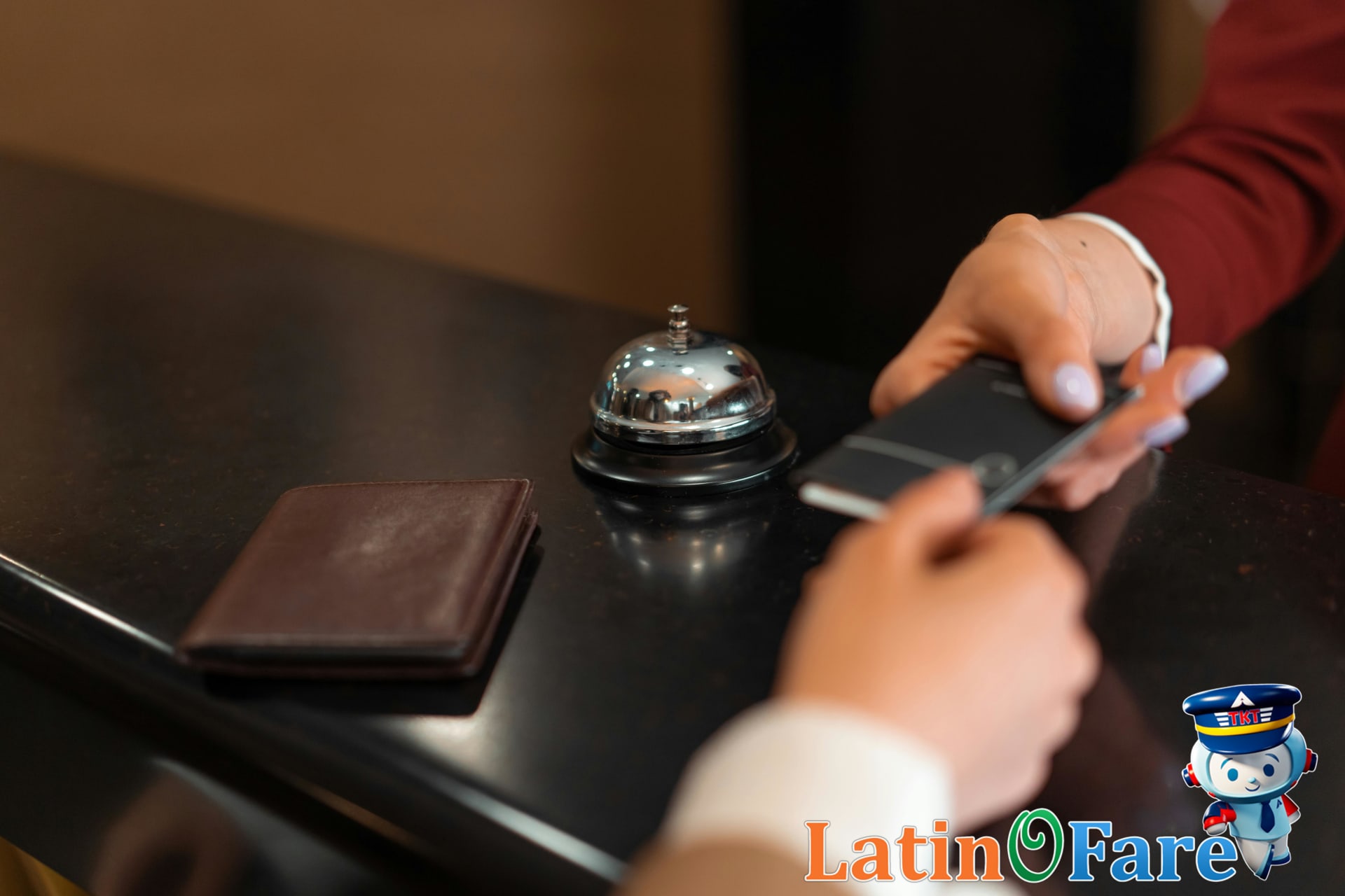 Traveler booking an IHG hotel using One Rewards points on smartphone app for maximum rewards.