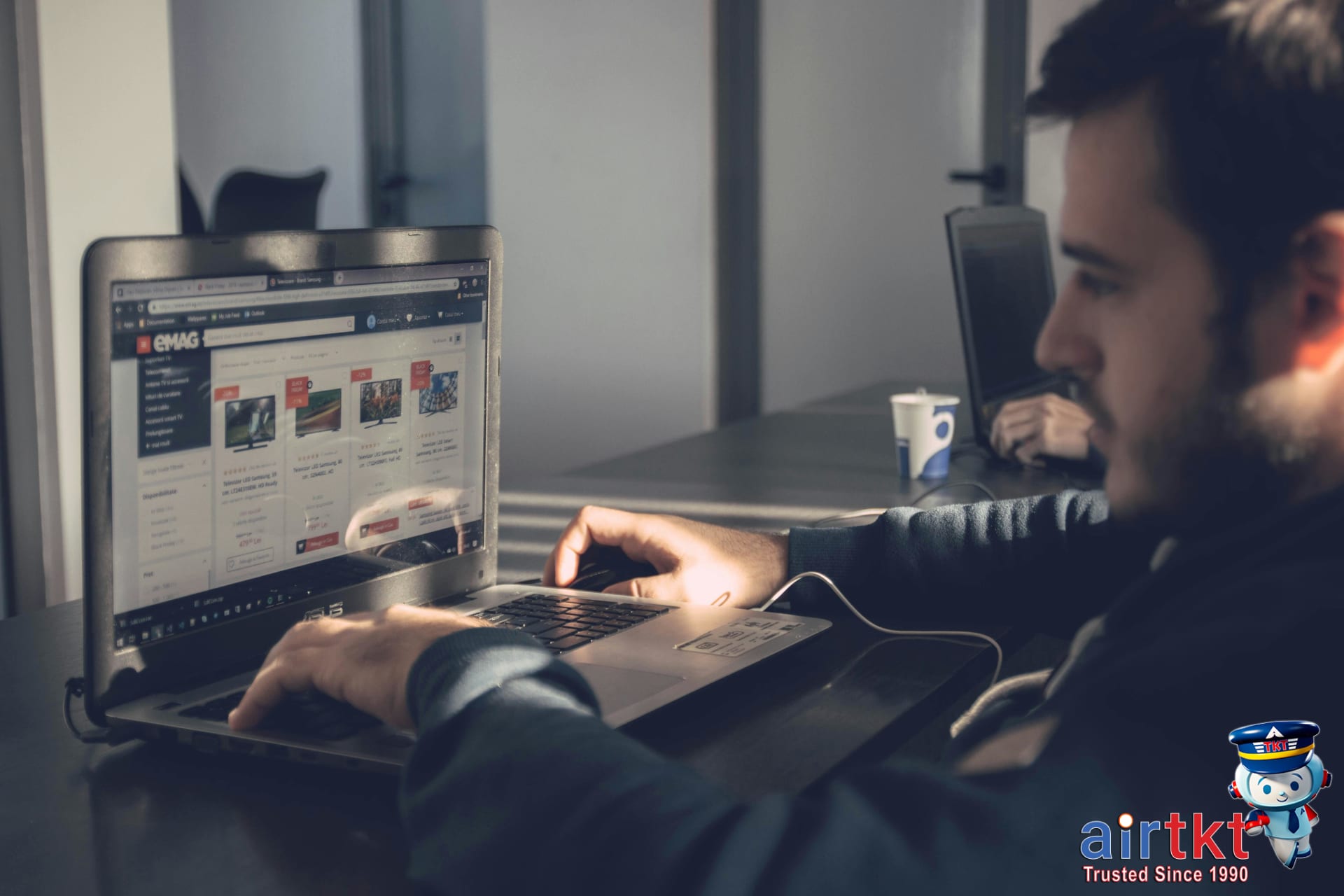 Traveler reading hotel and Airbnb FAQ information on laptop