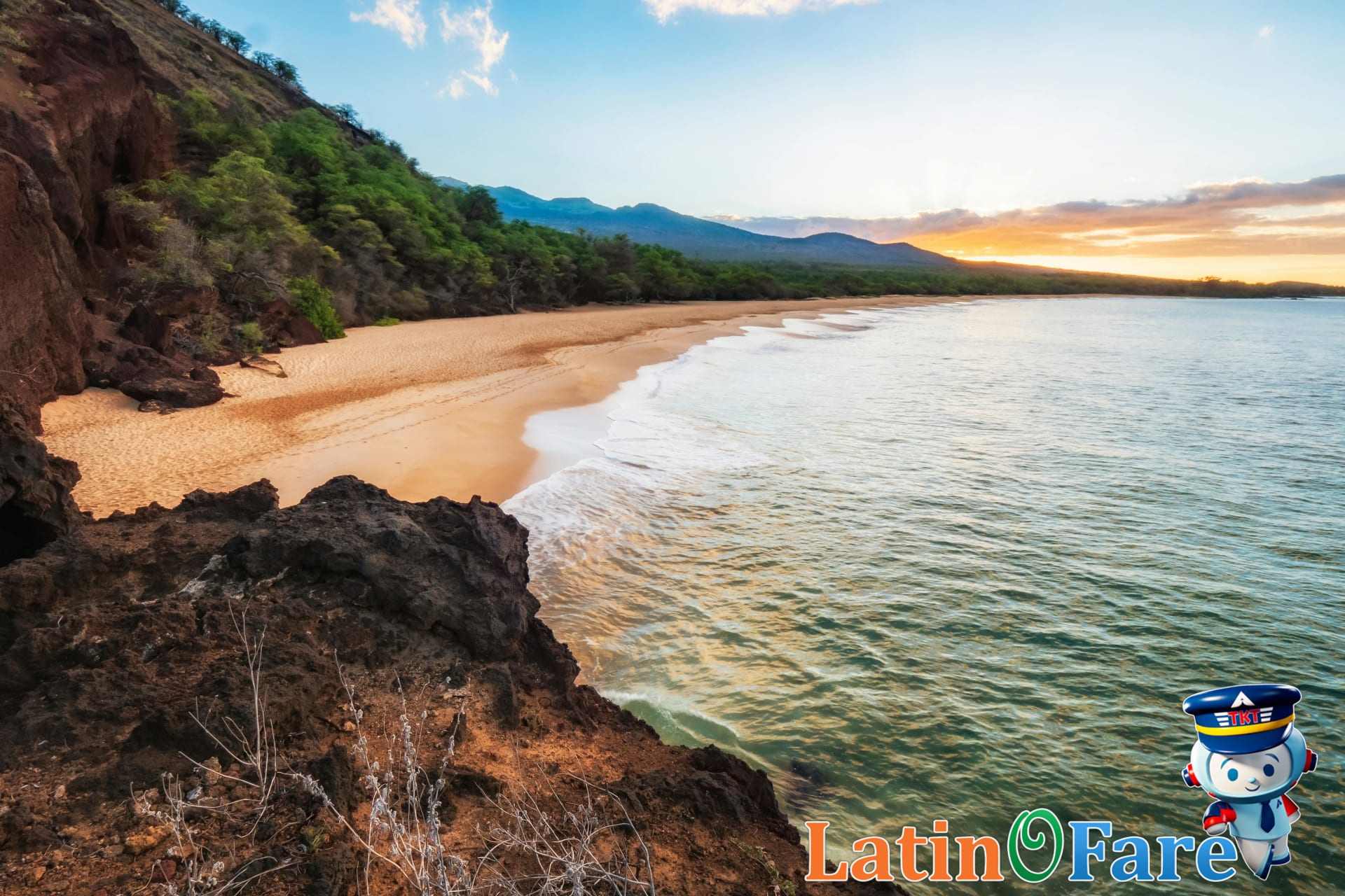 Golden Maui beach at sunrise with gentle ocean waves and volcanic cliffs, showing ultimate Maui beaches.