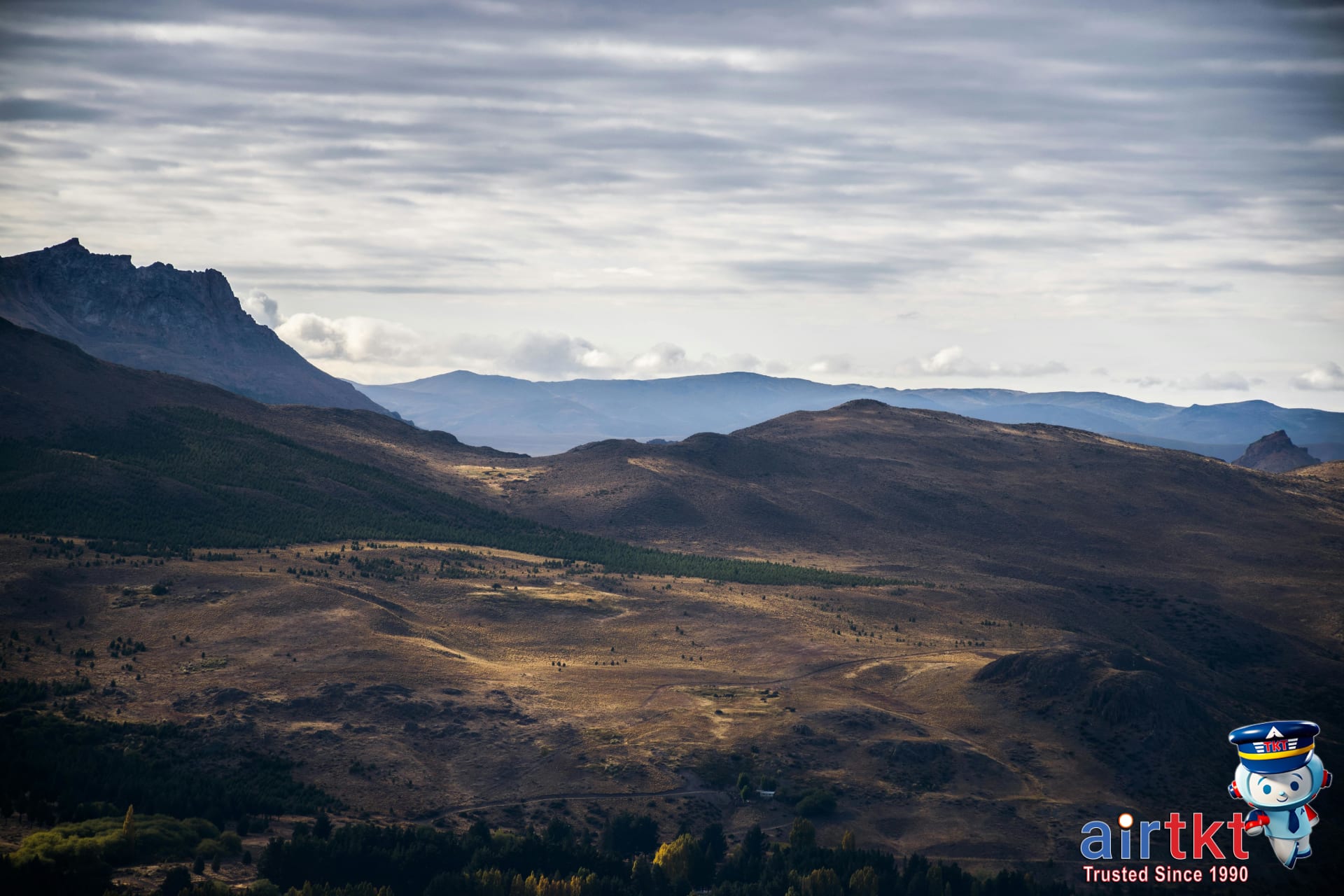 Expansive Patagonian landscape with mountains and skies in wide view