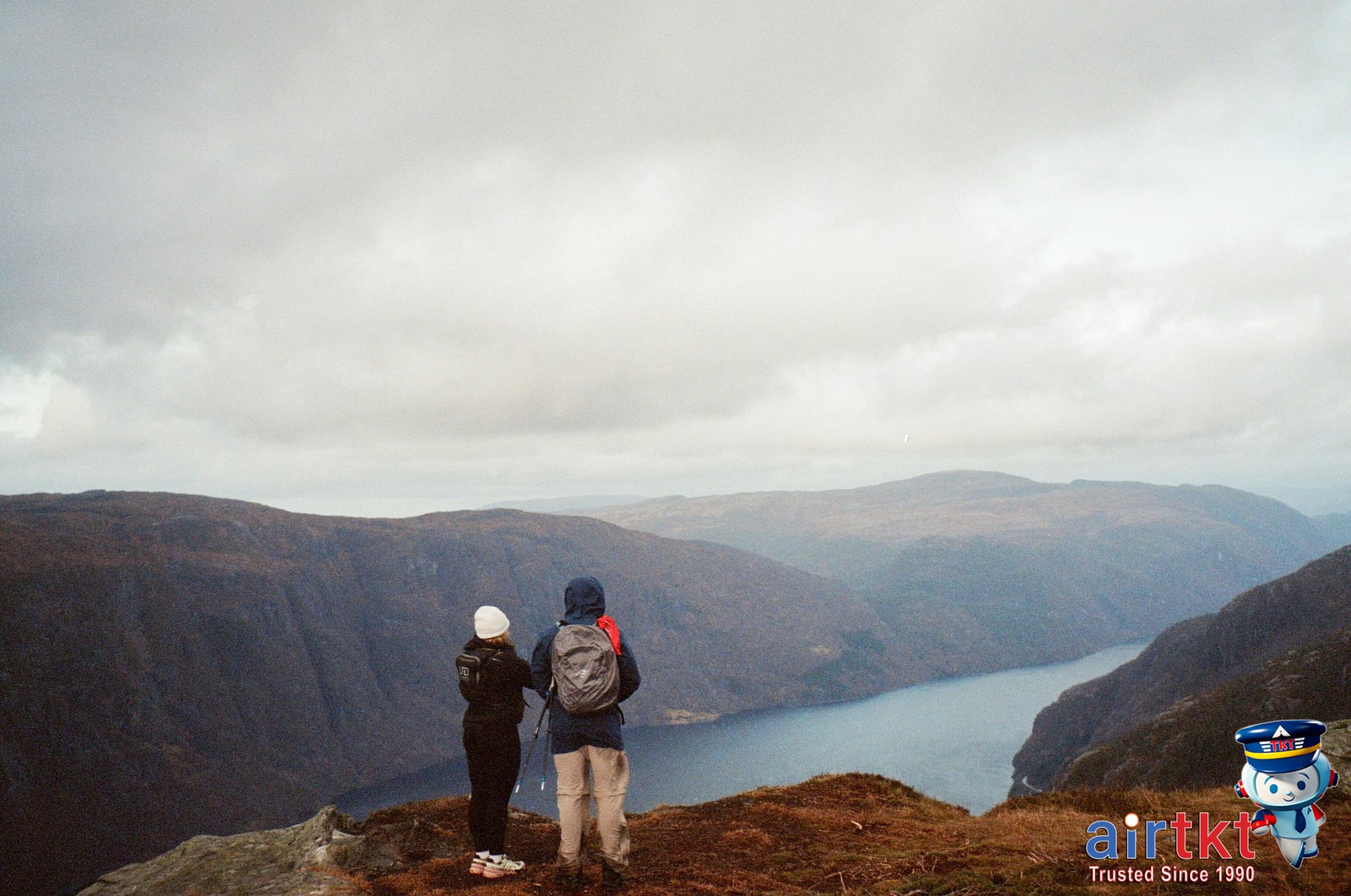 Hikers enjoying Norway fjords eco-tourism landscapes with panoramic views