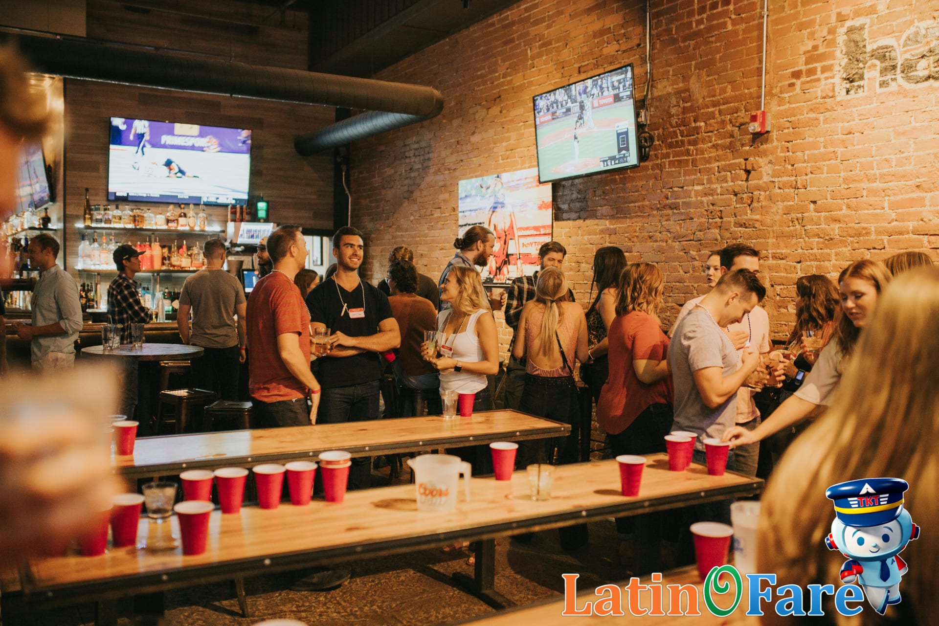 Basketball fans cheering at a lively NBA Finals watch party in downtown city bar