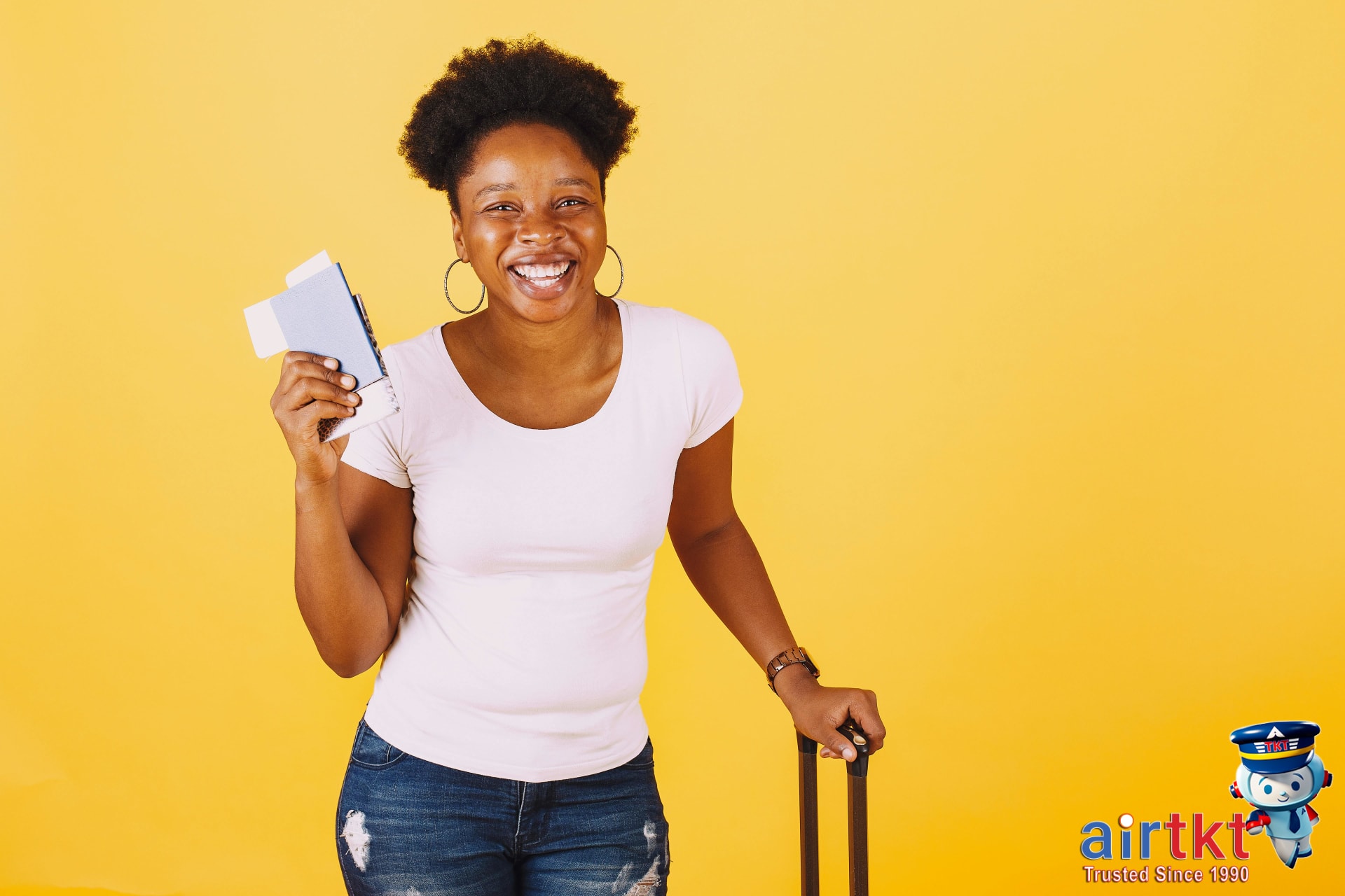Happy traveler holding flight and train tickets with satisfied smile
