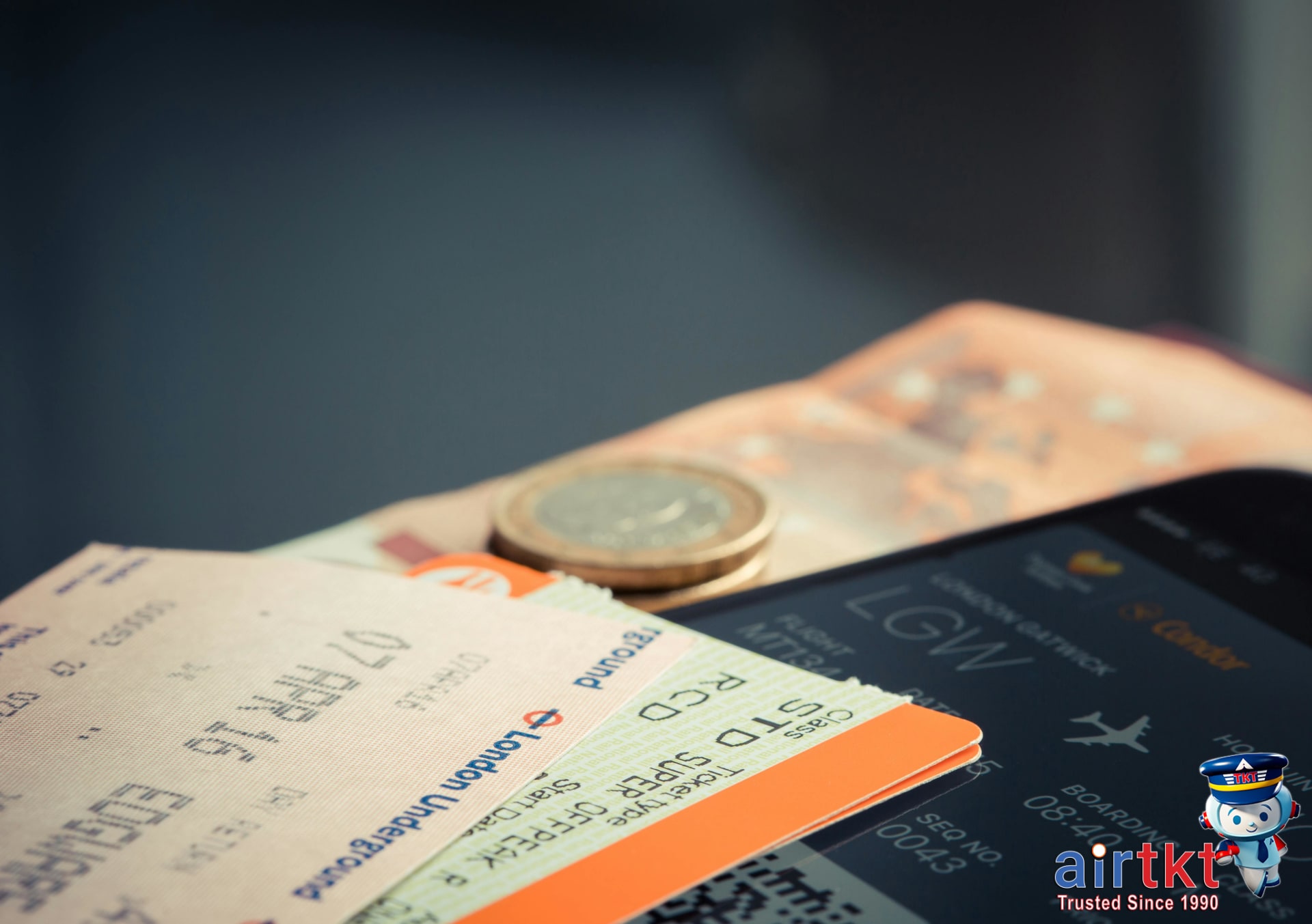 Travel itinerary with multiple split ticketing flight and train tickets on a wooden table