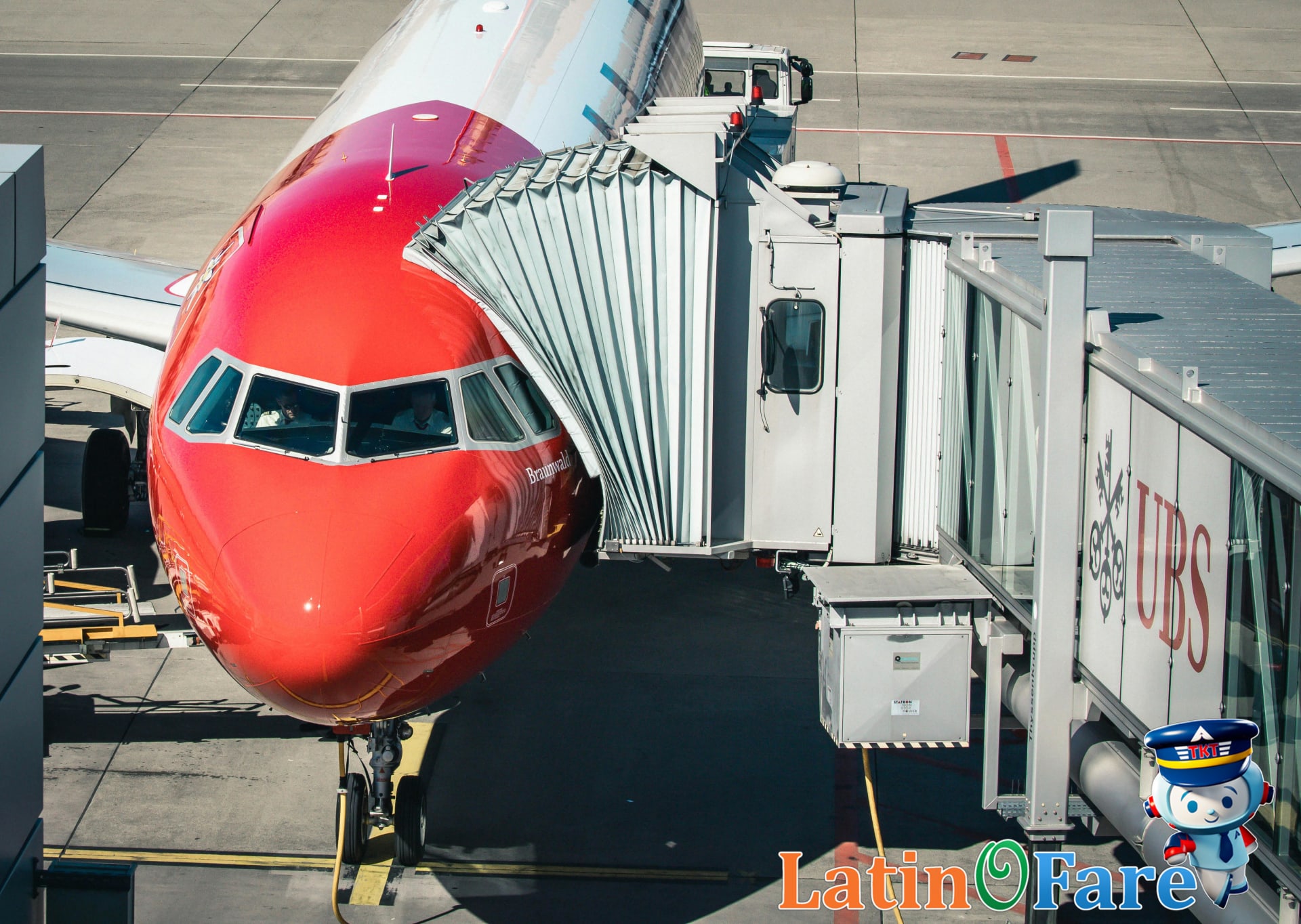 Family with young children boarding Avianca airplane in Colombia for group South America travel experience.