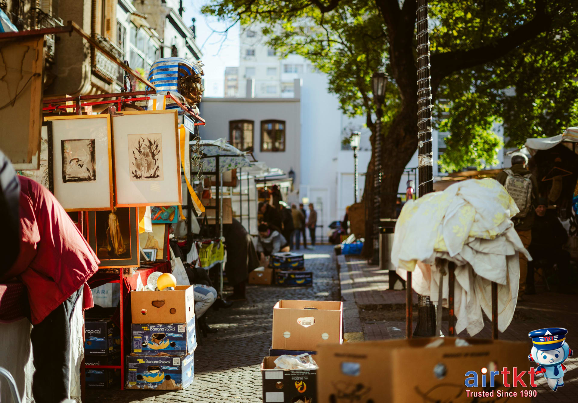 Busy street market scene in Buenos Aires with local vendors and shoppers