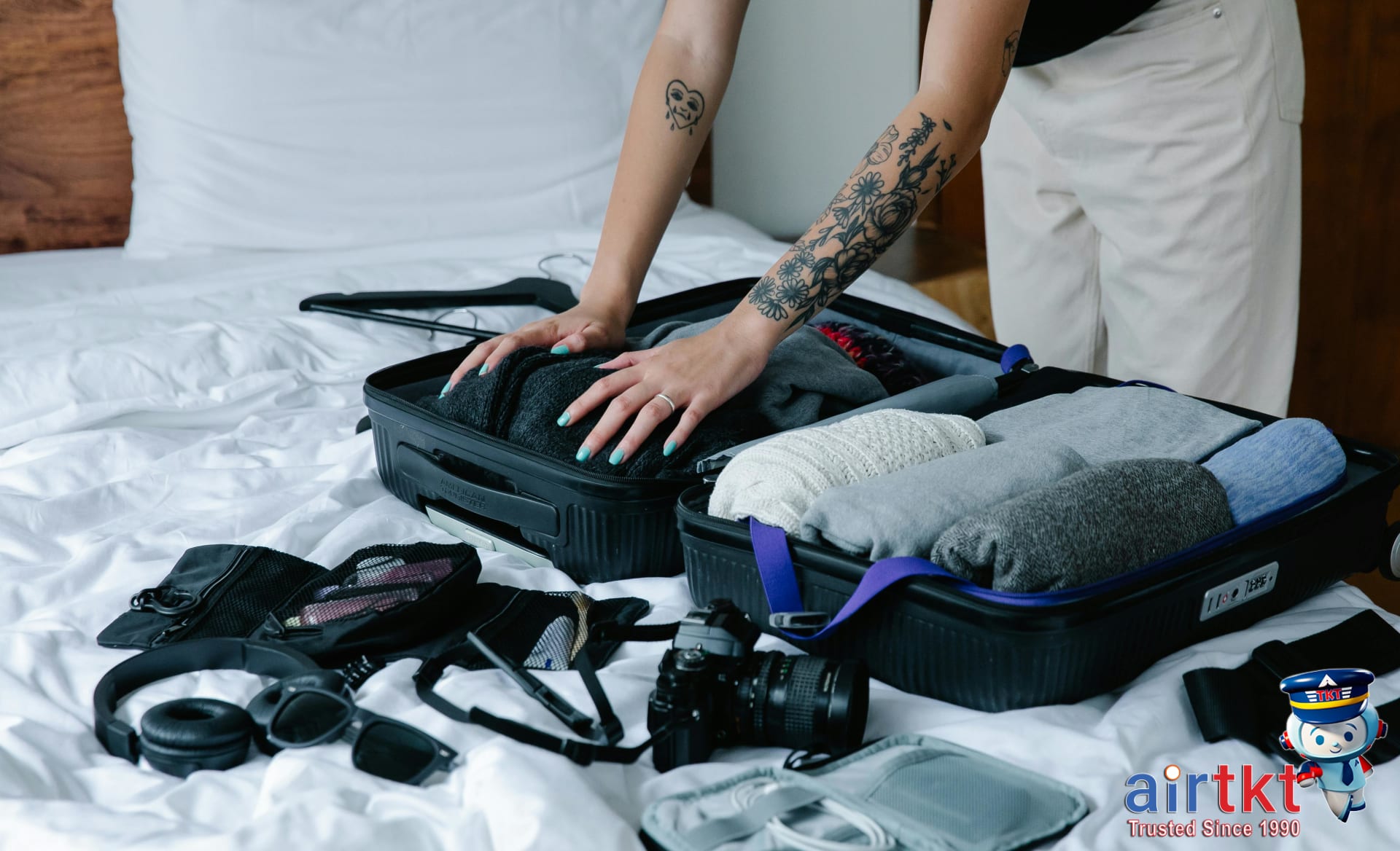 Traveler packing hurricane season essentials for a Caribbean trip in a compact bag