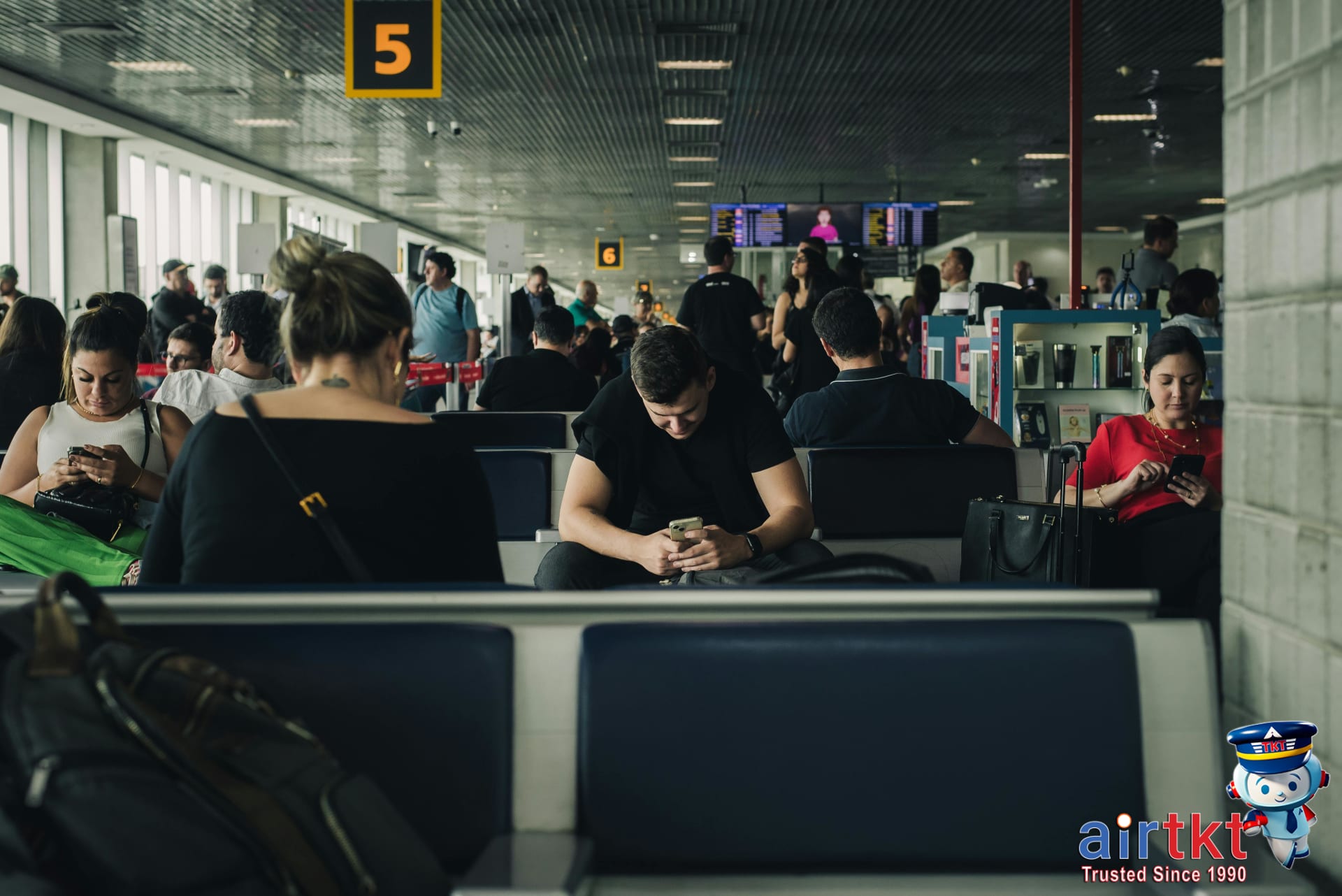 Travelers researching Caribbean travel deals online on laptop for discount flights