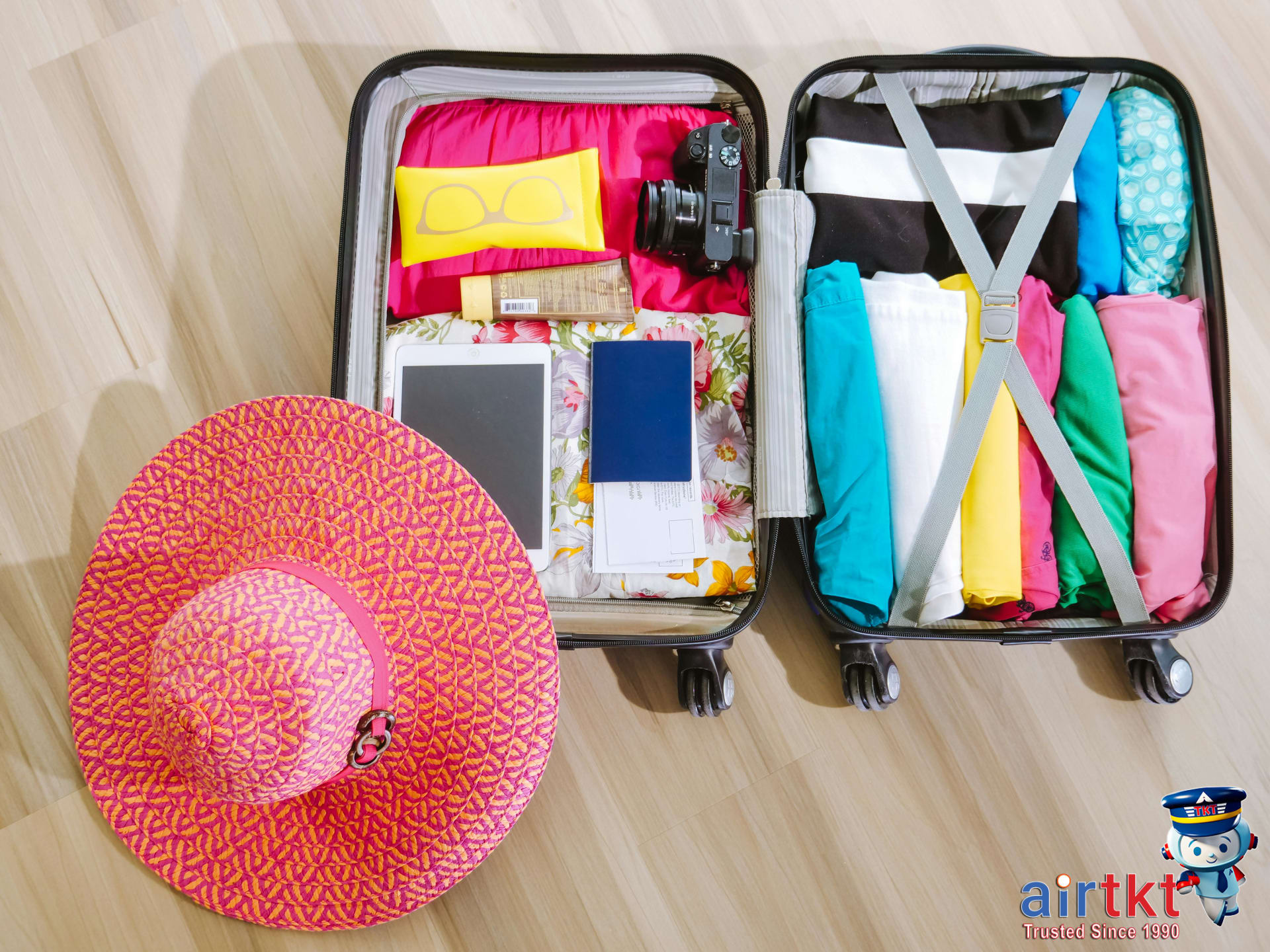 Packing essentials for summer travel in June with lightweight clothing and accessories.