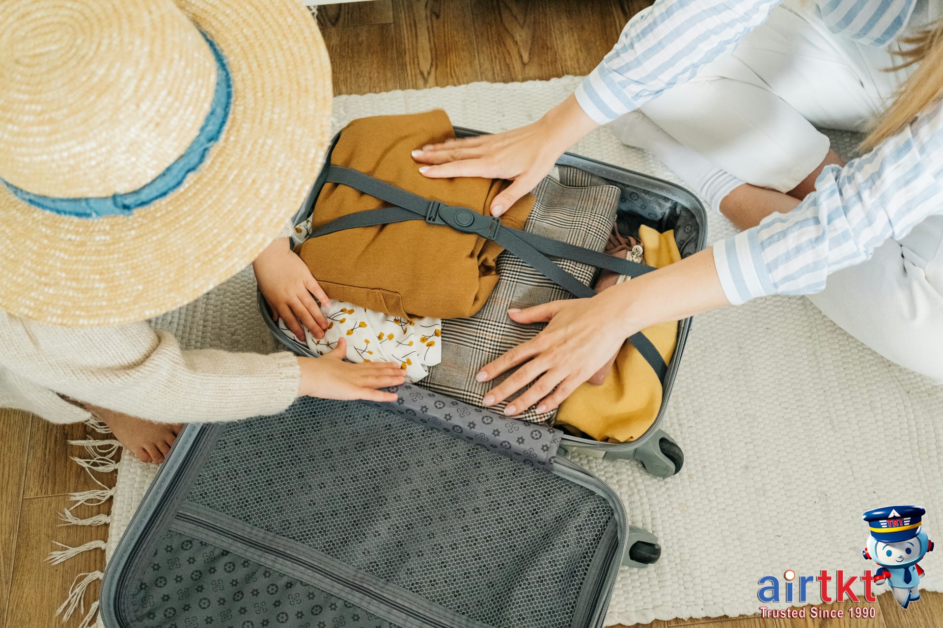 Family packing for a summer vacation in June with travel essentials.
