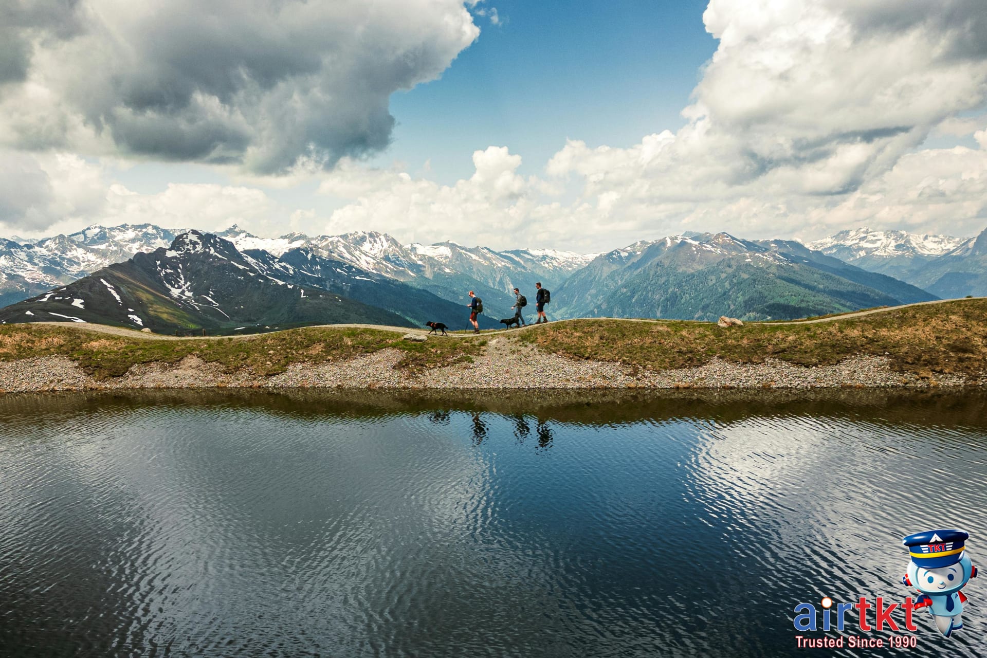 Hikers exploring outdoor adventures on a mountain trail in June.