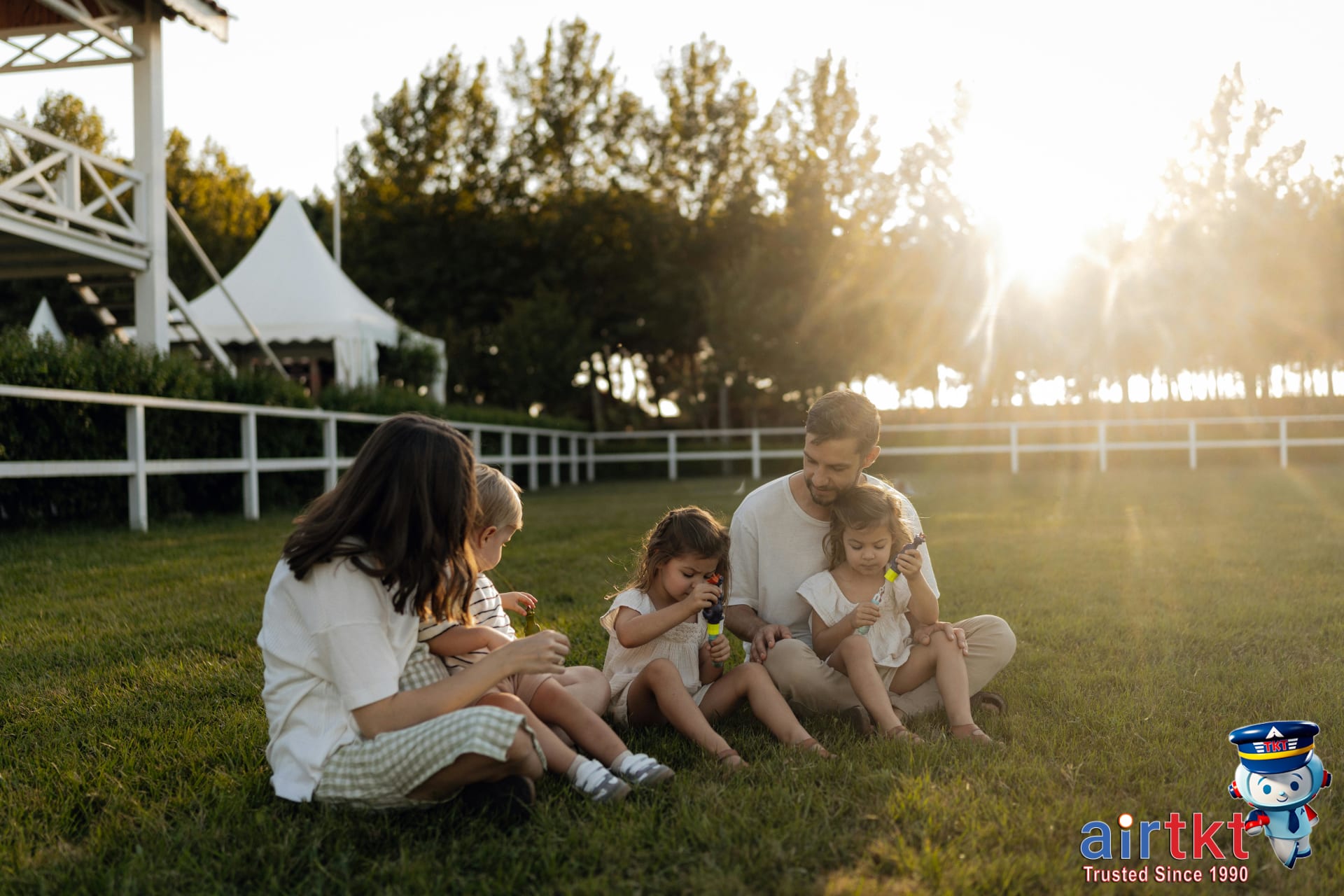 Family enjoying time at a green park in June, showing why June travel is popular