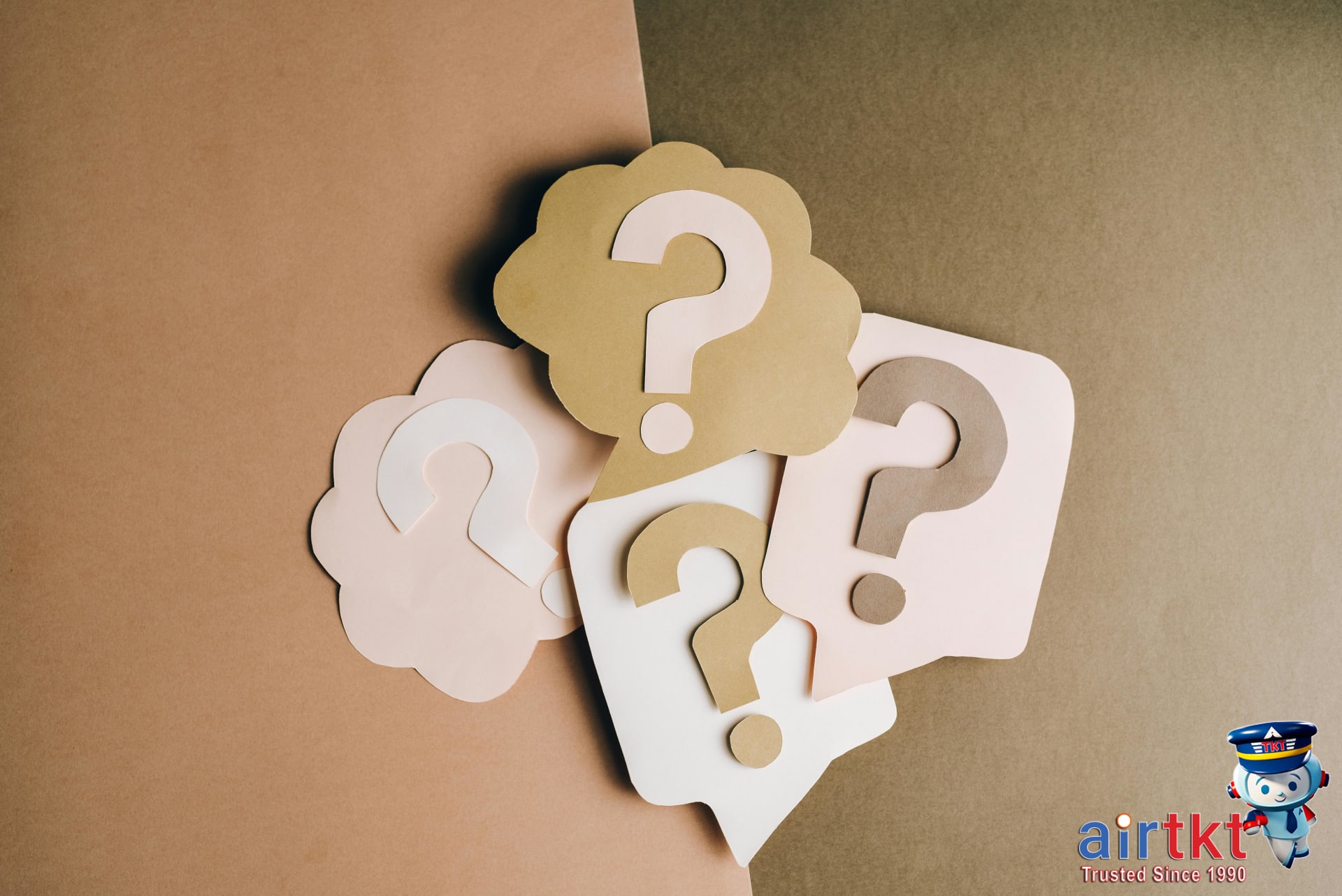 Flight booking FAQs illustration with question mark paper cutouts
