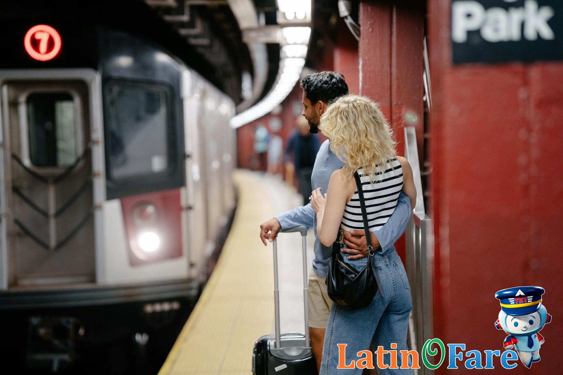 Travelers alert with luggage at busy train station, illustrating best pickpocket avoidance tactics at transit hubs.