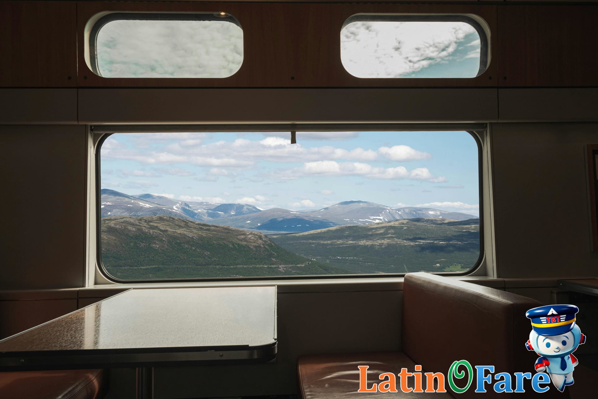 Wide countryside view from Amtrak train window on USA cross-country route, ideal for scenic rail trips.