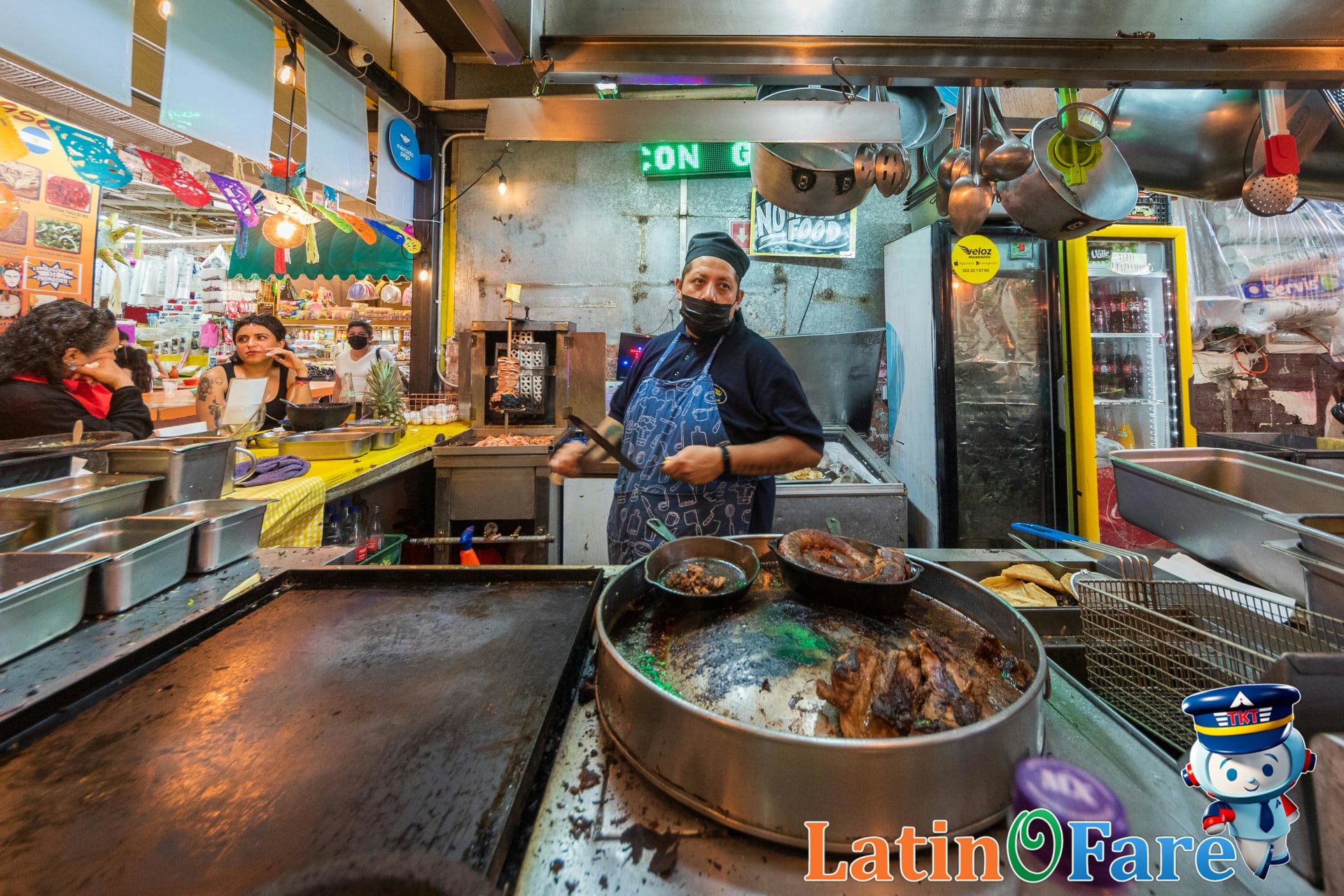 Street food vendor at work in a bustling Mexico City market, budget travel in action