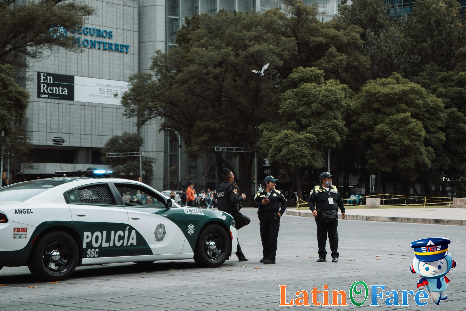 Police officers on patrol in a Mexico City park, ensuring public safety for travelers