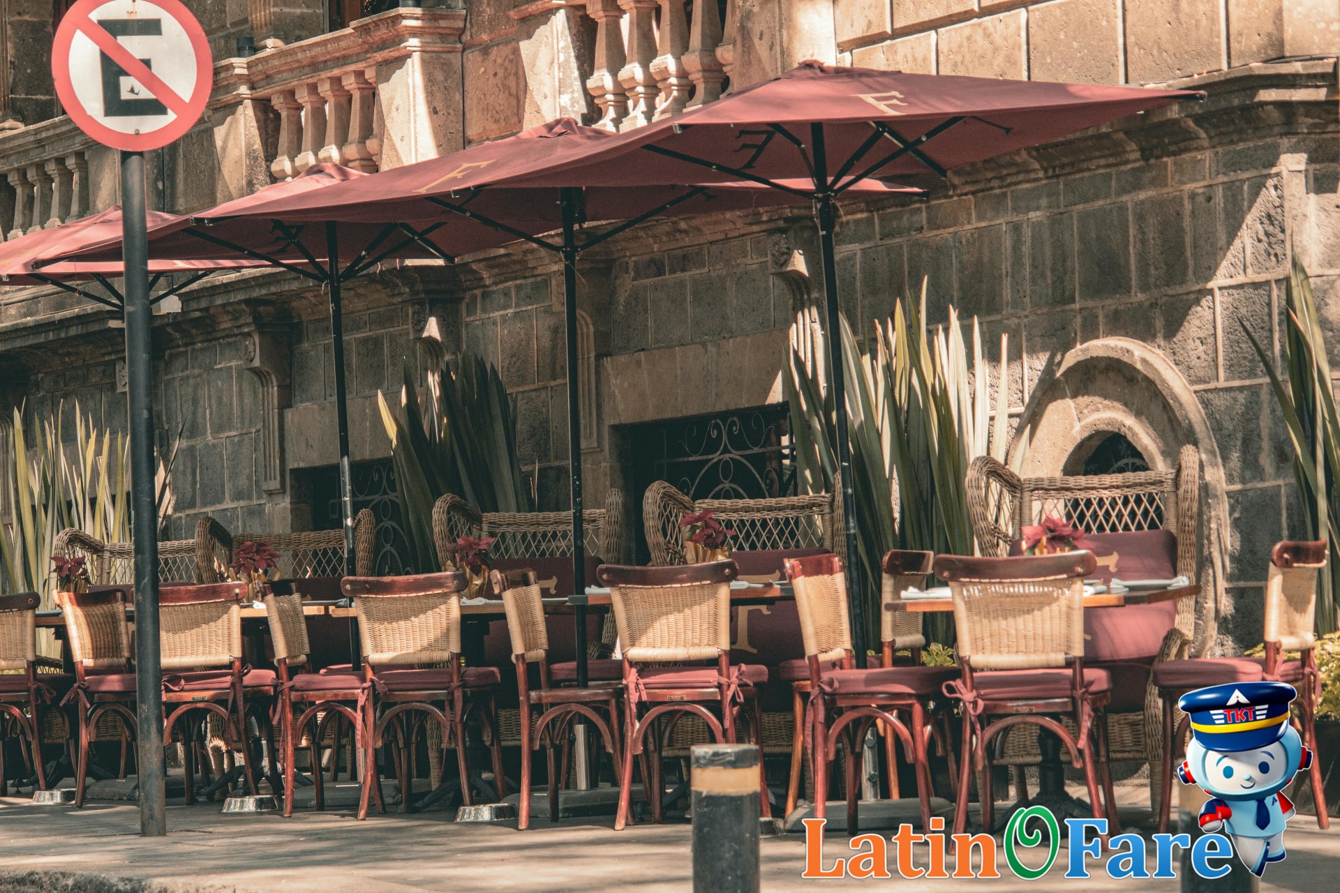 Outdoor café with red sun umbrellas inviting guests in Condesa Roma neighborhood Mexico City