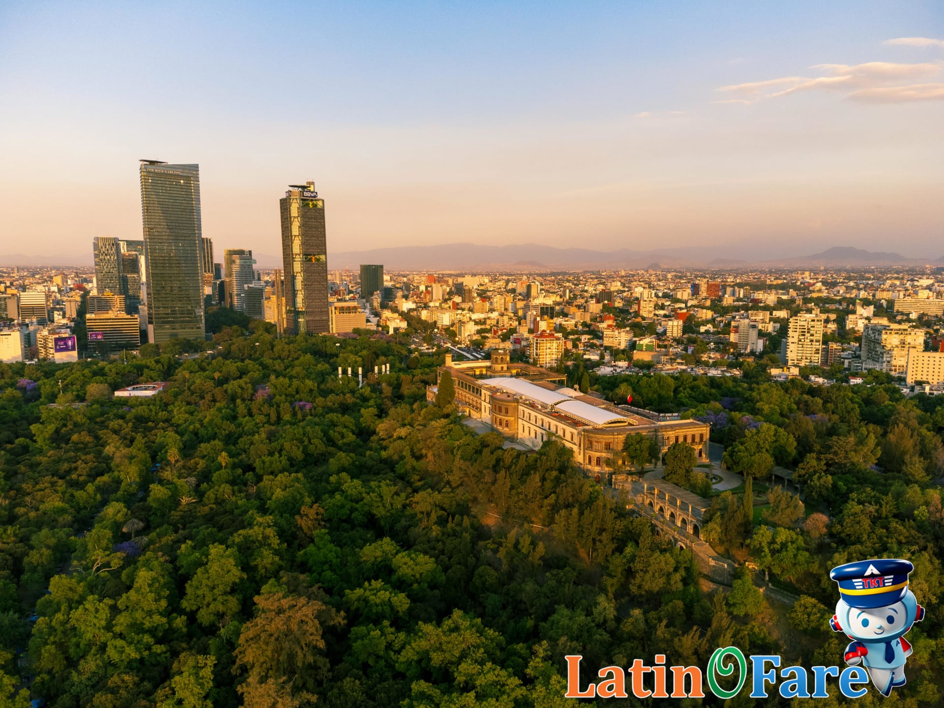 Aerial view of Chapultepec Castle and the Mexico City skyline with lush greenery