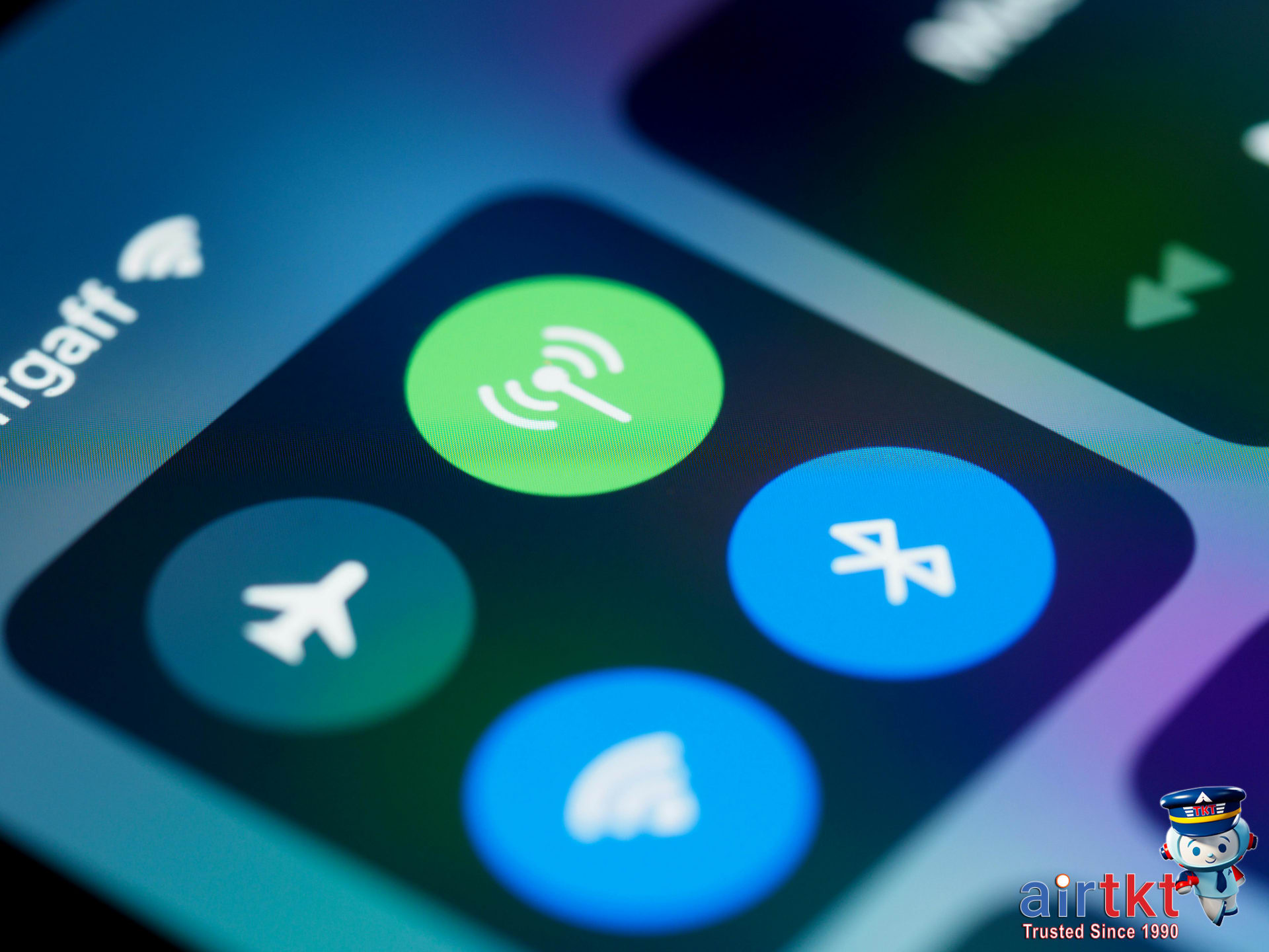 Close-up of mobile devices with signal icons and a globe showing connectivity