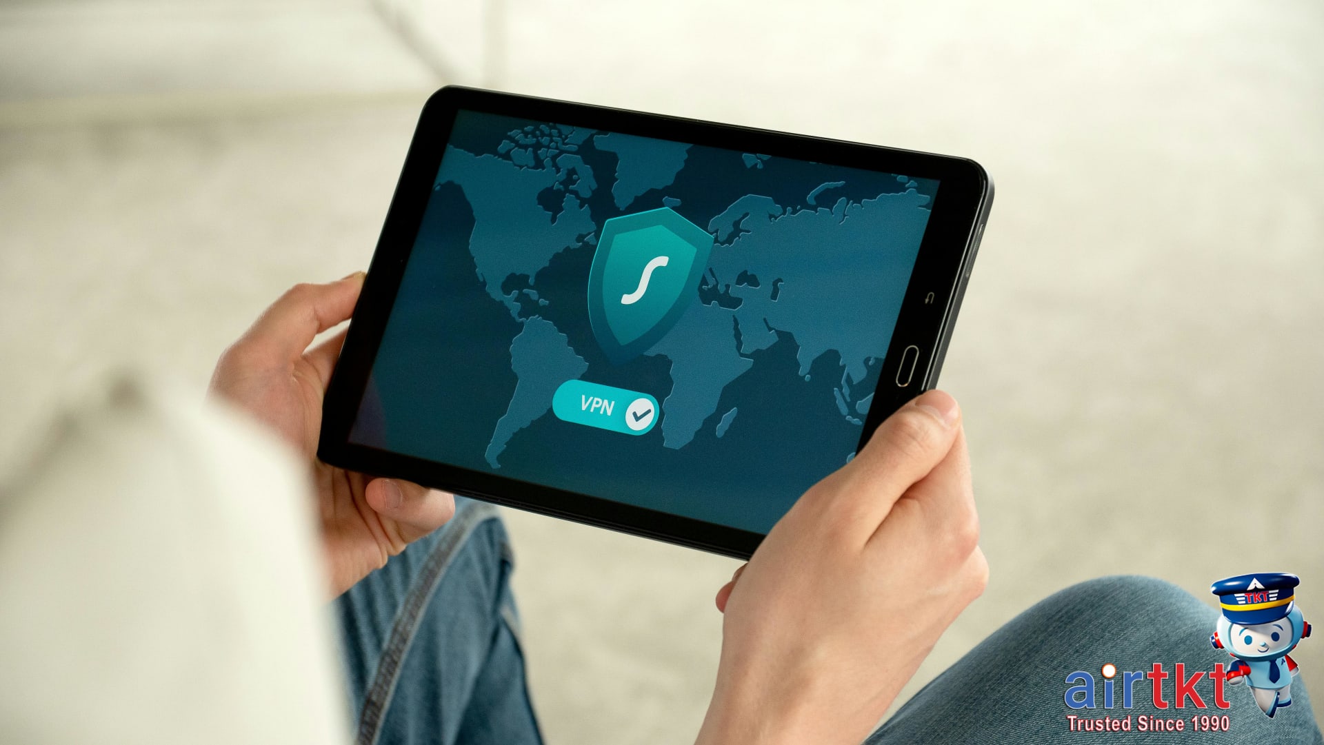 Traveler reading ATM safety FAQs on tablet device while traveling