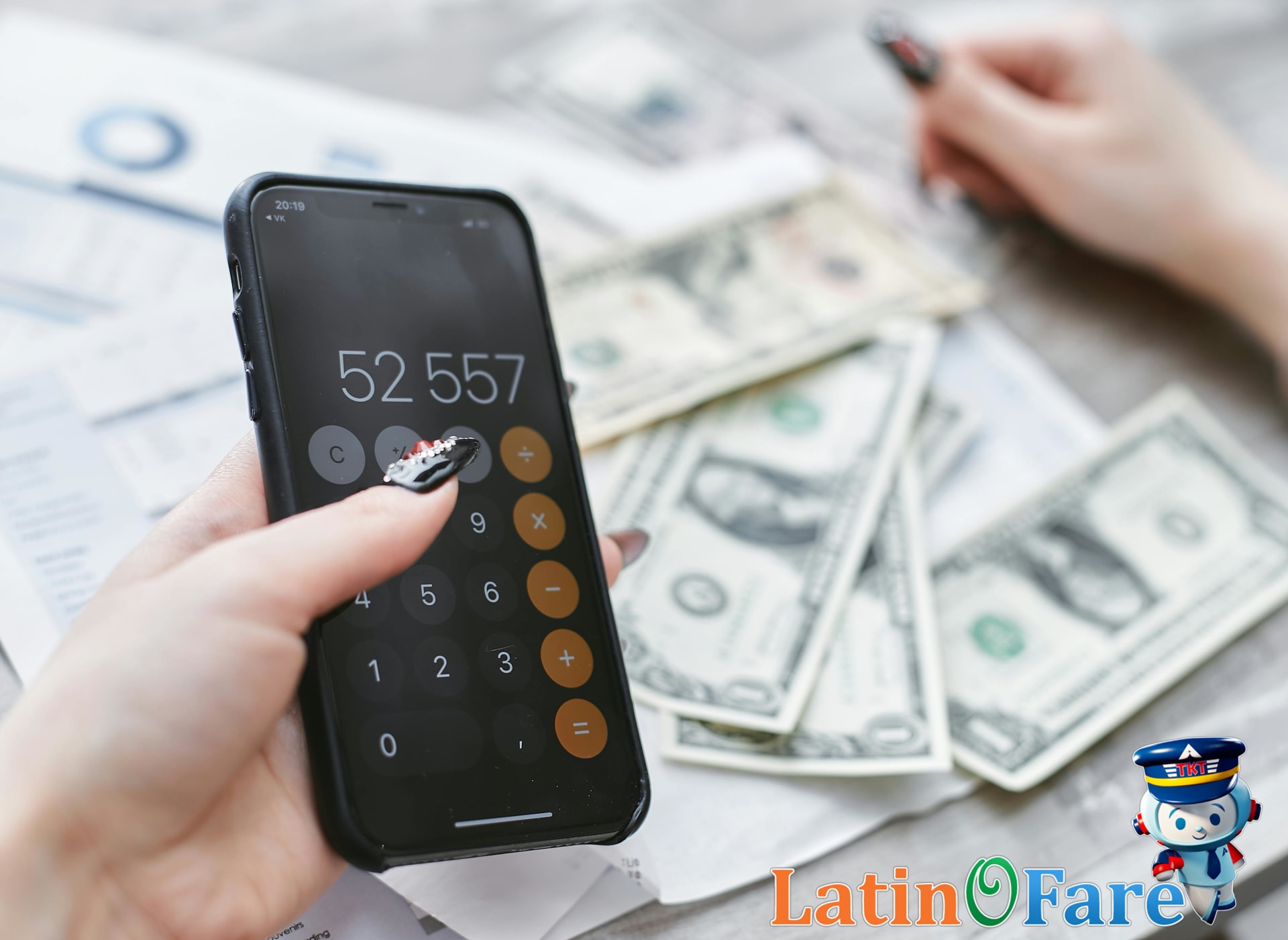 Budgeting for Labor Day travel calculating trip costs with phone and papers