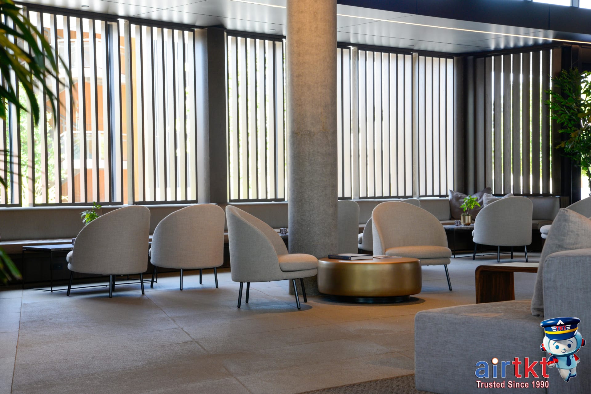 Amenities offered by airport and downtown hotels shown in stylish hotel lobby