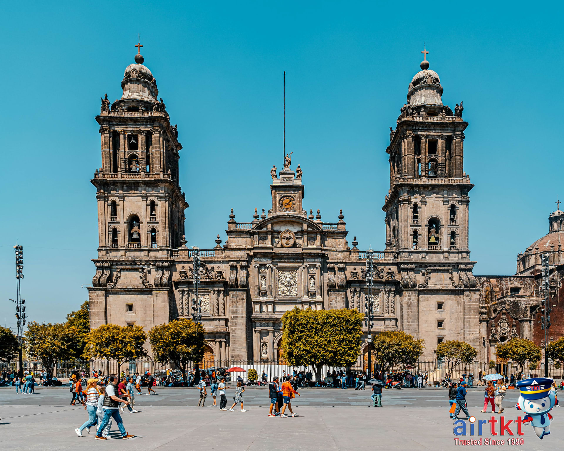 Metropolitan Cathedral in Mexico City with tourists visiting central historic Zócalo plaza during the day