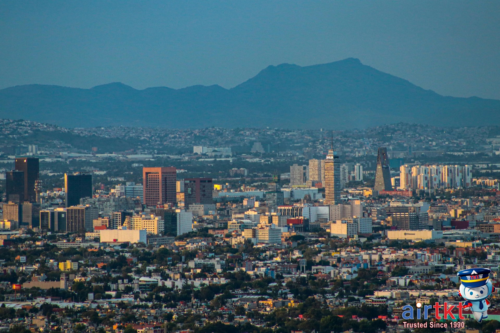 Aerial view of Mexico City skyline showcasing vibrant urban landscape and mountains