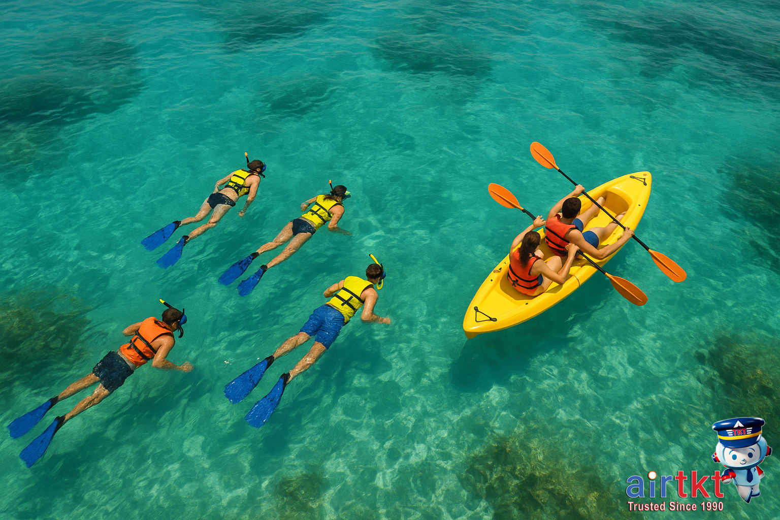 Tourists snorkeling and kayaking in turquoise Cancun waters