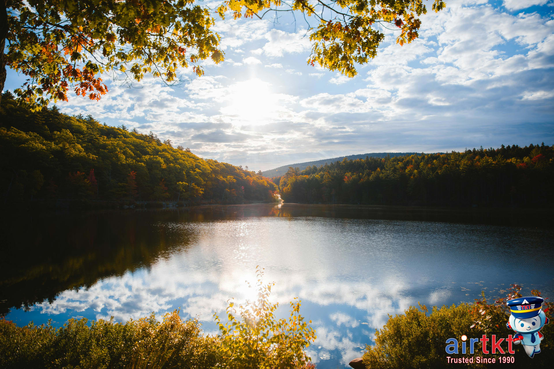 Sunset view over colorful New England autumn forest landscape during peak foliage