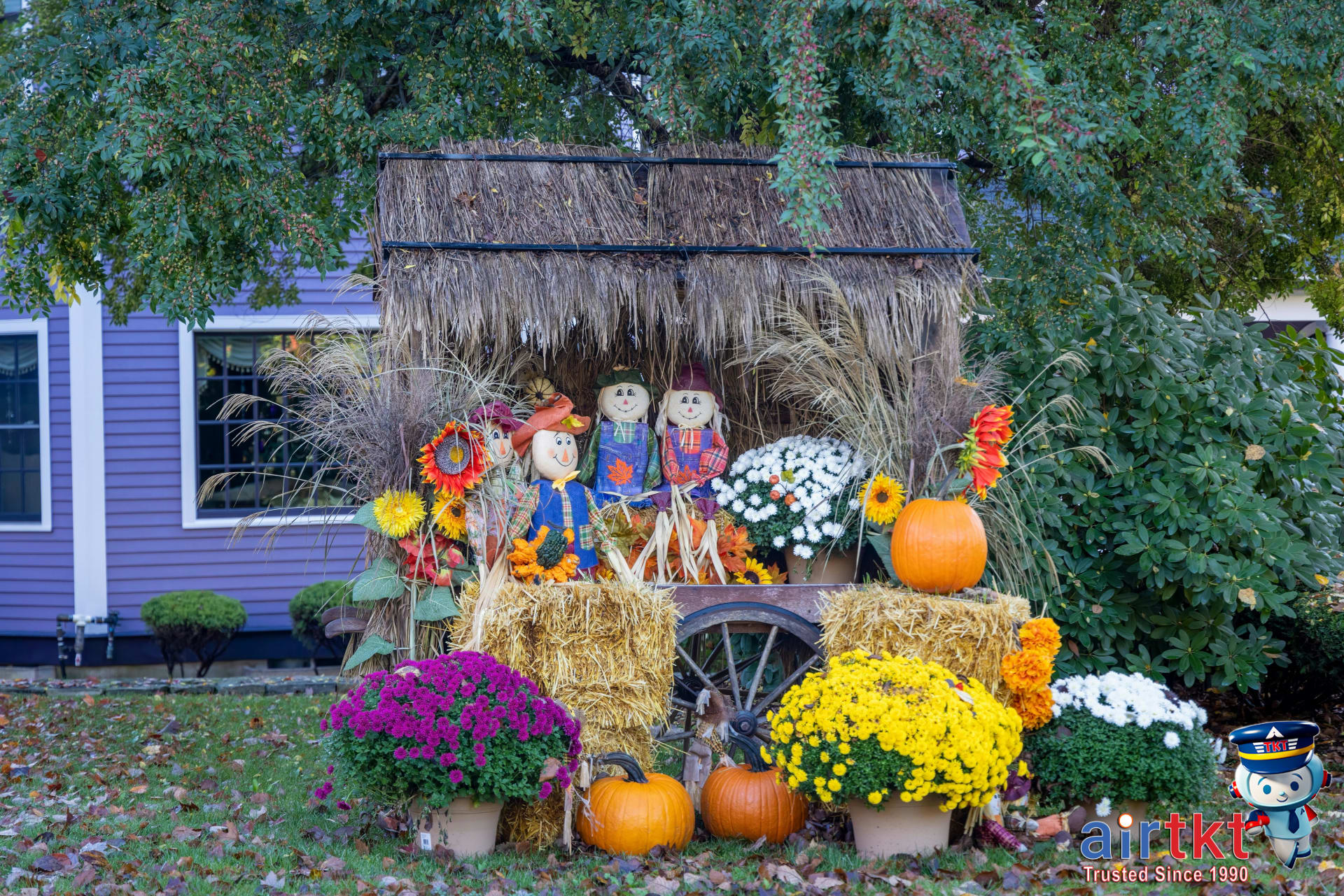New England fall harvest festival with pumpkins and scarecrows on display