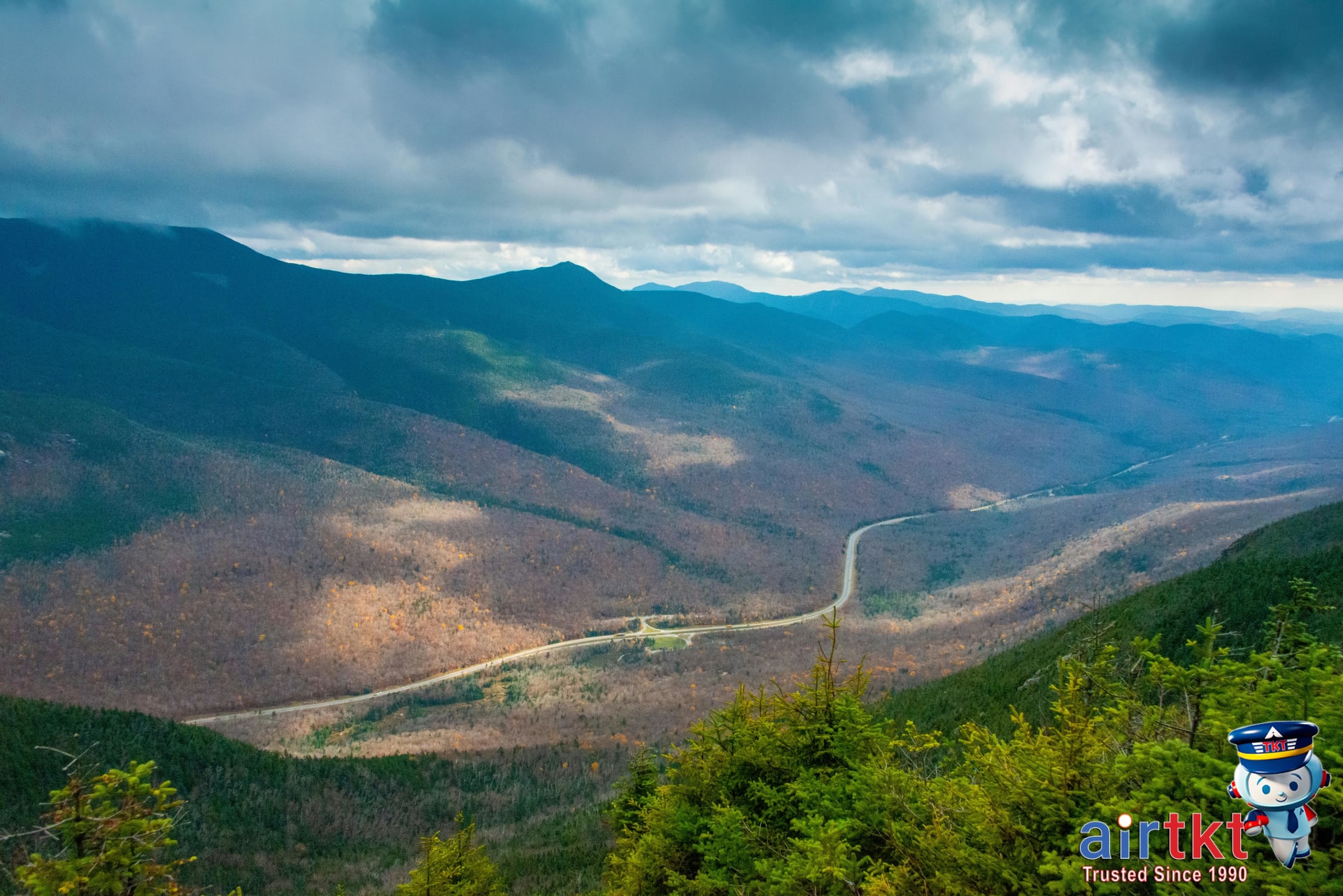 Panoramic view of White Mountains with vibrant New England fall foliage colors