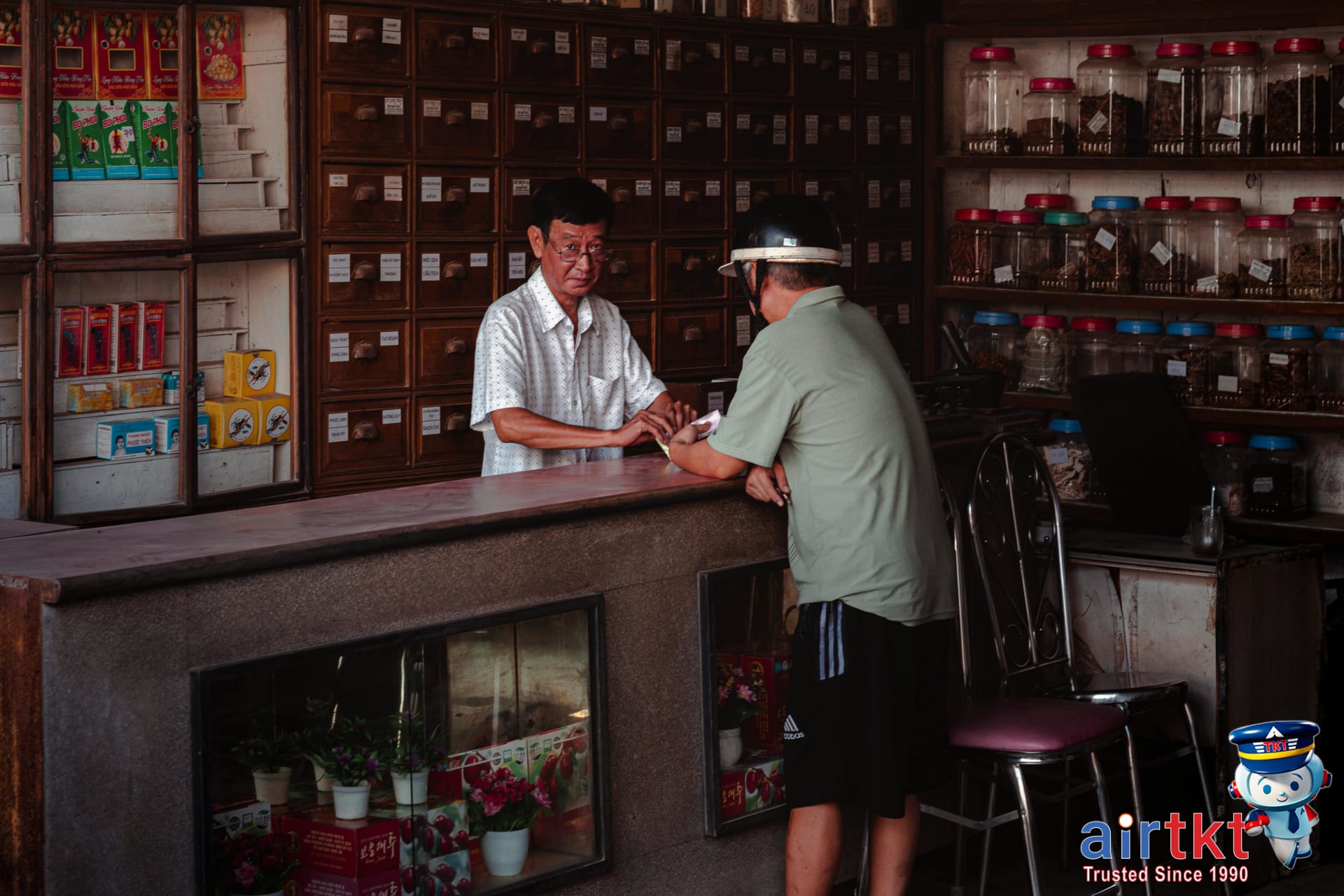 Traveler checking information at local pharmacy for healthcare access abroad