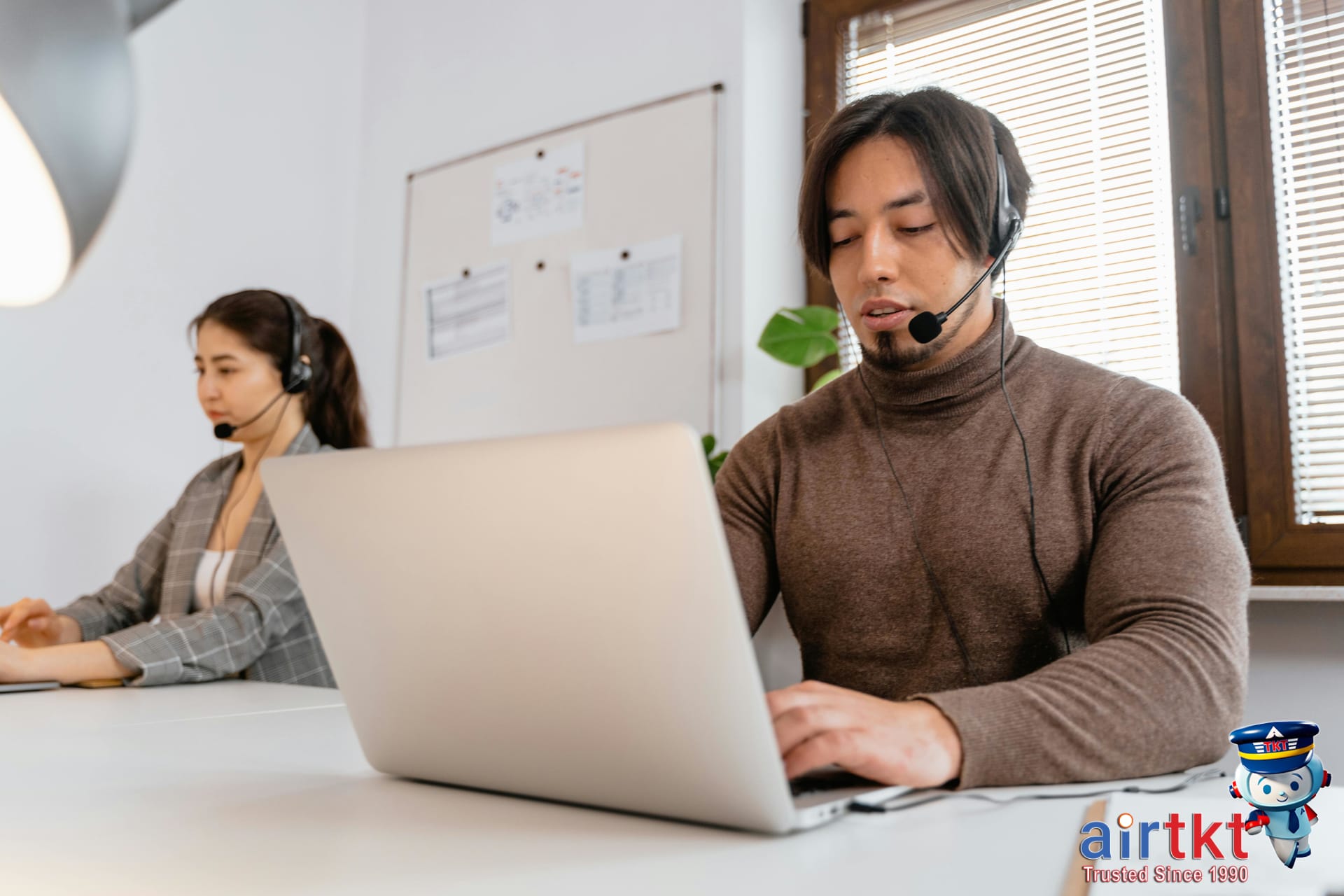 Customer support agents assisting travelers online with hotel booking guidance