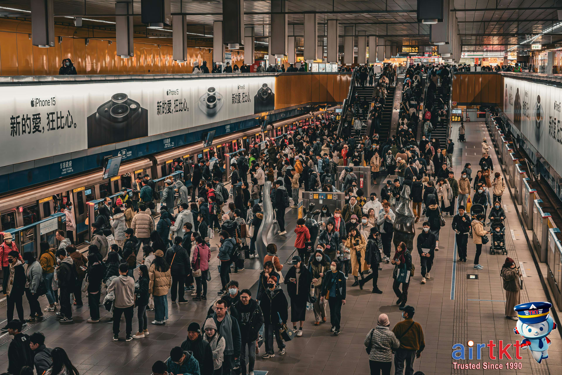 Crowded Los Angeles Metro rail platform at rush hour with commuters waiting for train