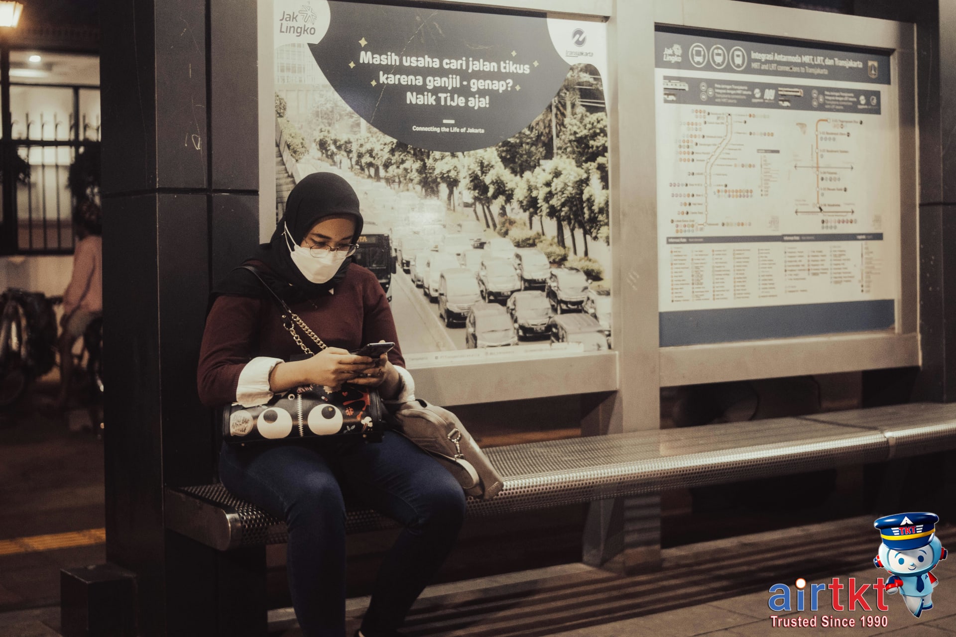 Traveler planning Los Angeles public transit route using smartphone map app