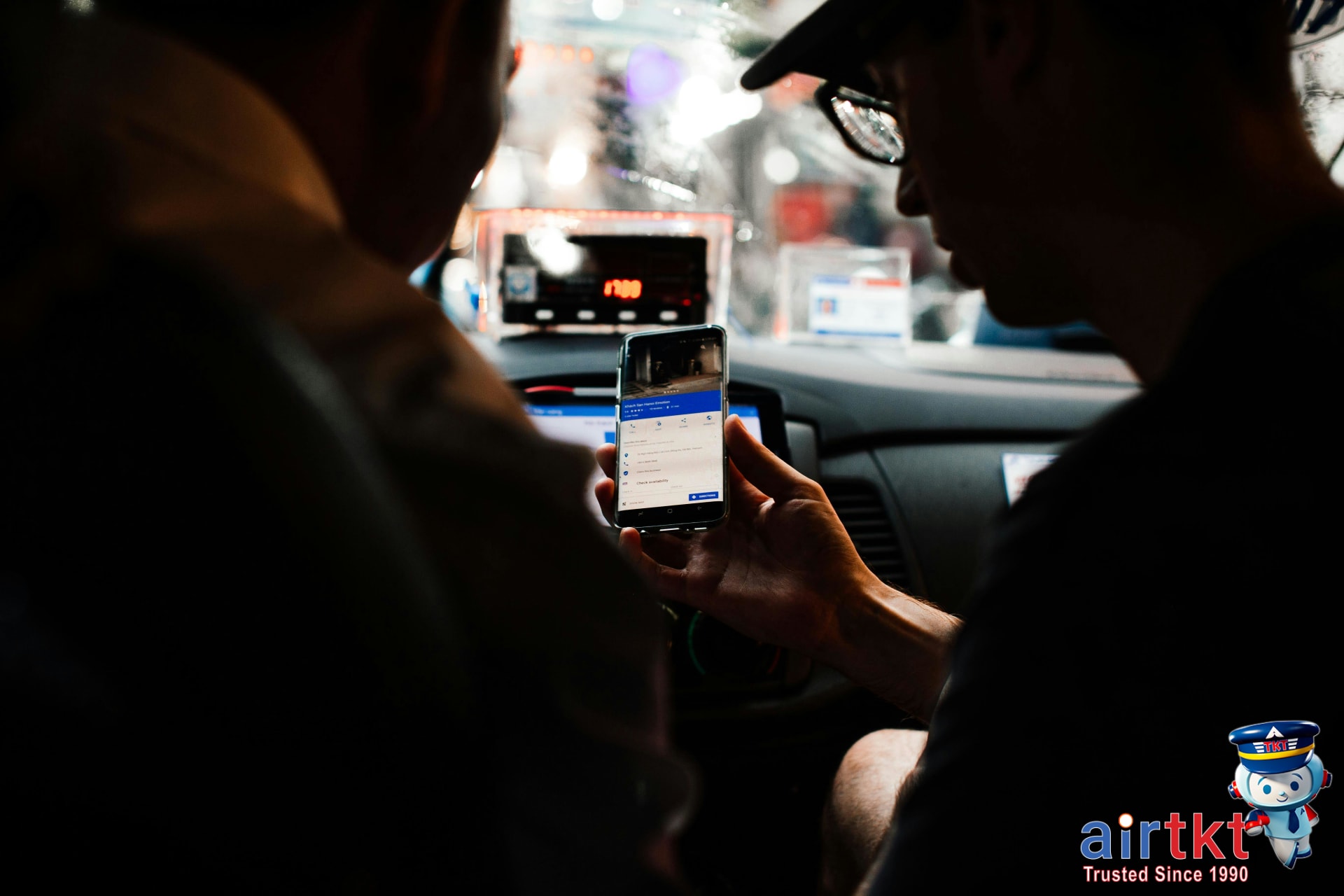 Passenger using rideshare app for Los Angeles transportation on smartphone