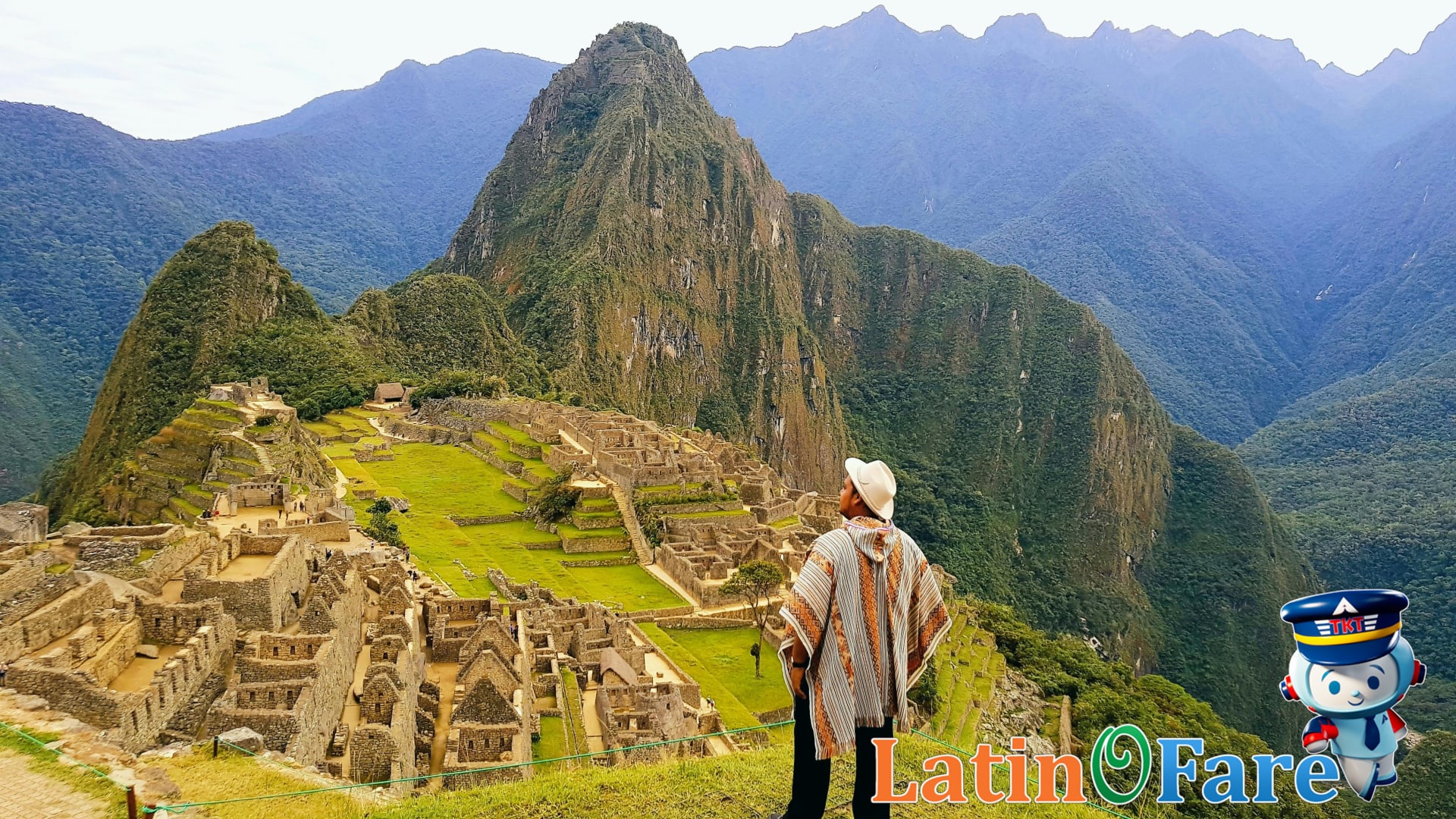 Traveler wearing traditional clothes admiring Machu Picchu ruins in scenic Peru landscape