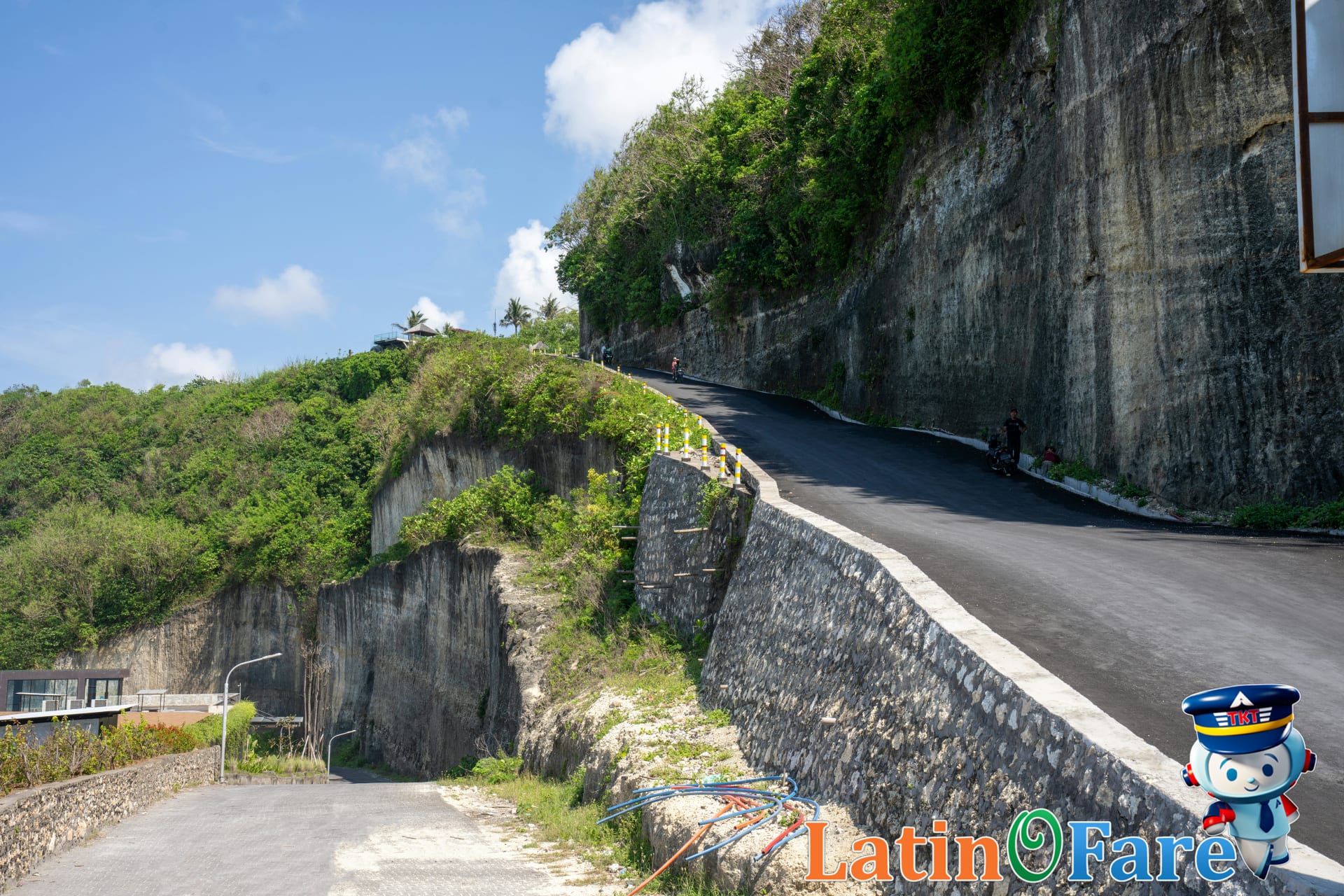 Scooter traveling down a scenic winding road in Bali, popular transport option for visitors