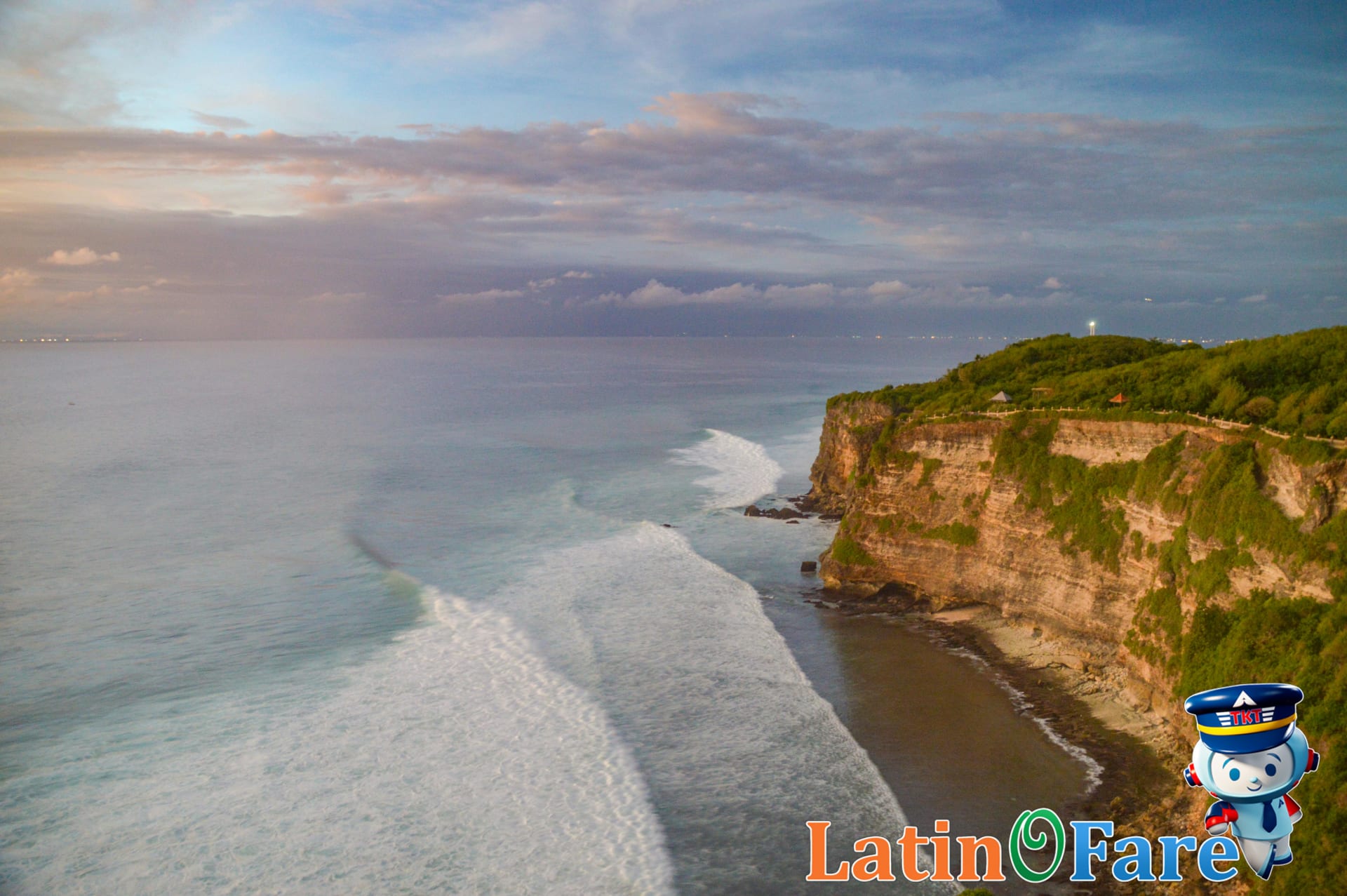 Traveler admiring dramatic Bali sunset from a cliffside viewpoint on their first trip