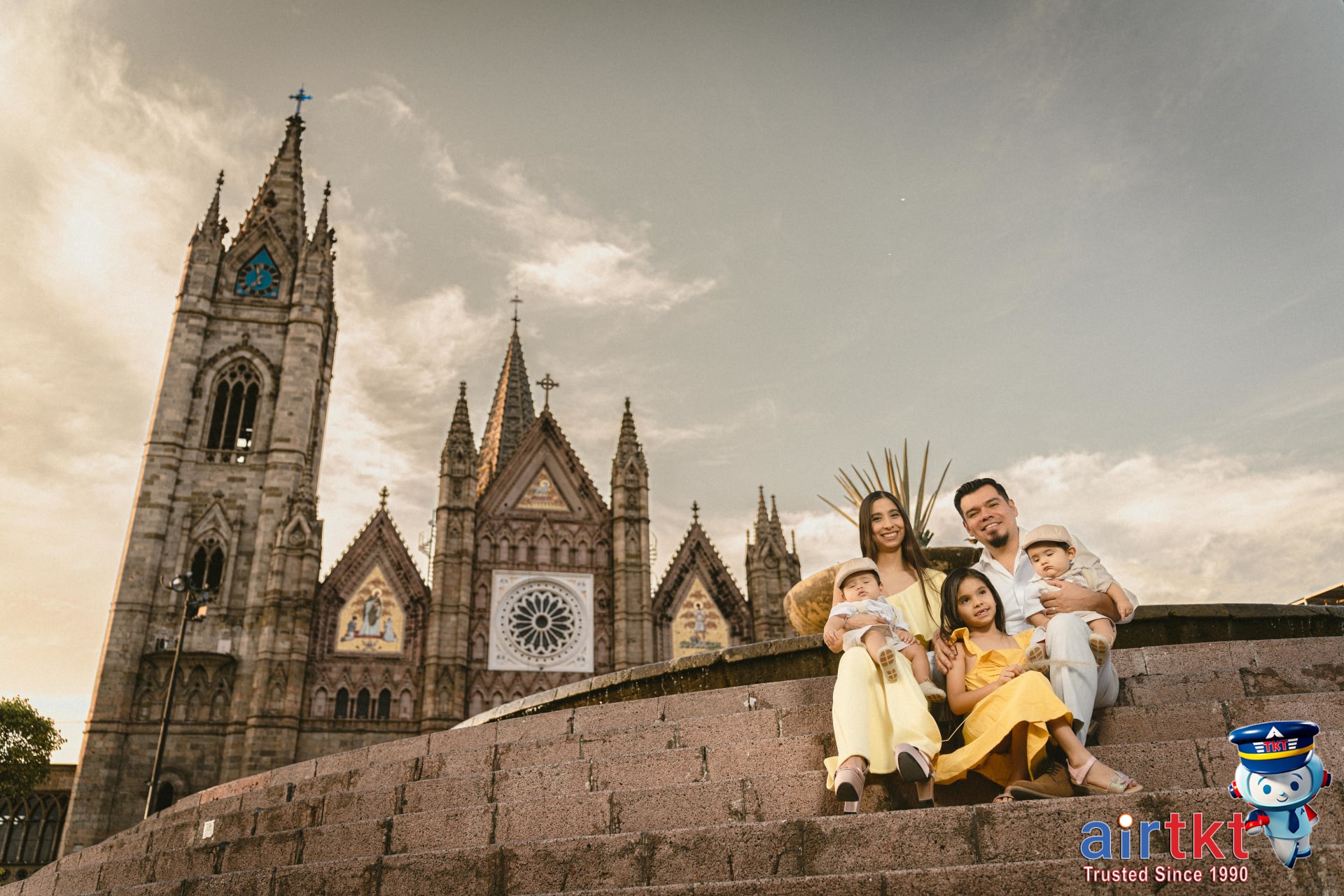 Smiling family enjoying a lively street festival in Guadalajara, Mexico