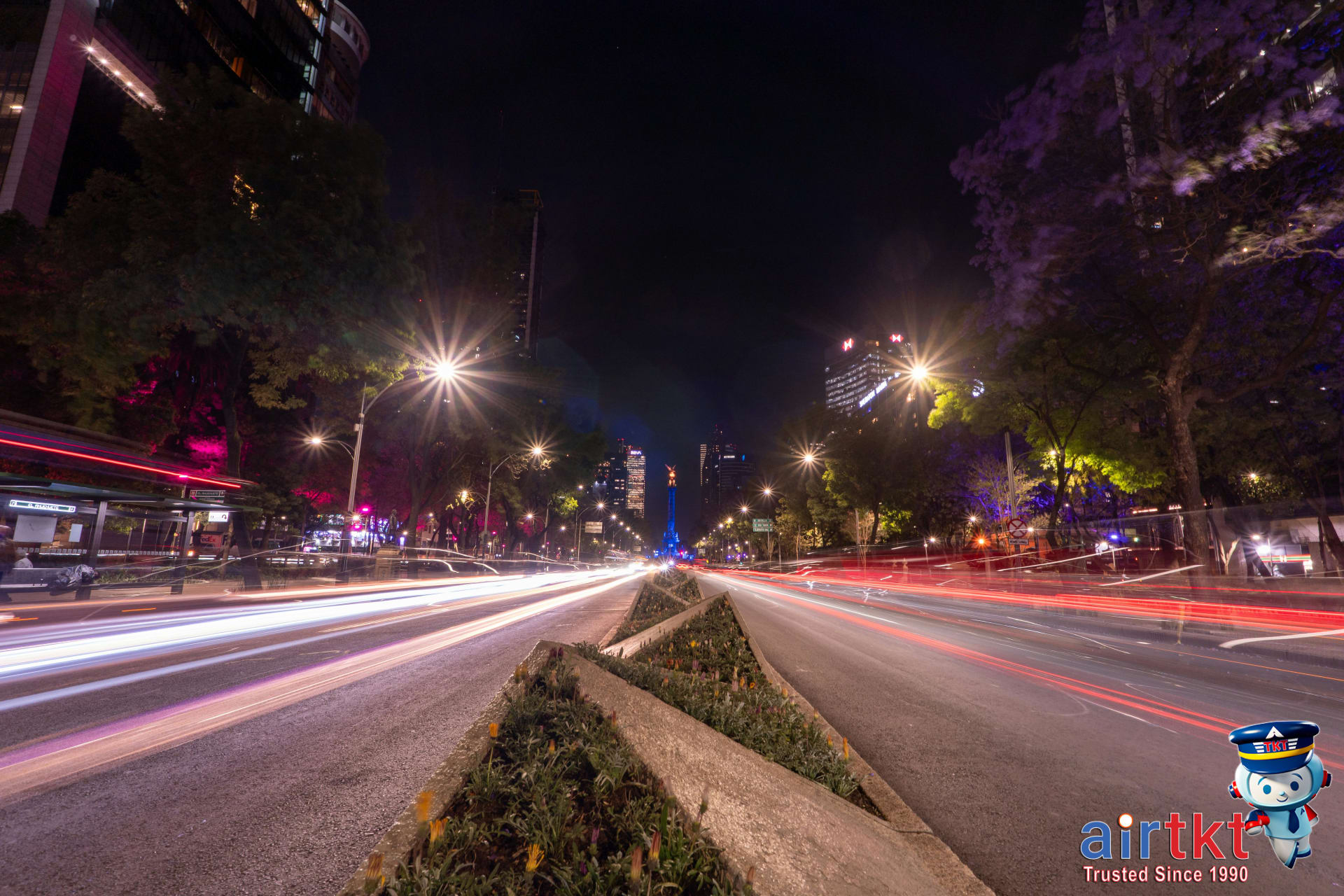 Nightlife scene with long exposure city traffic and vibrant lights in Guadalajara